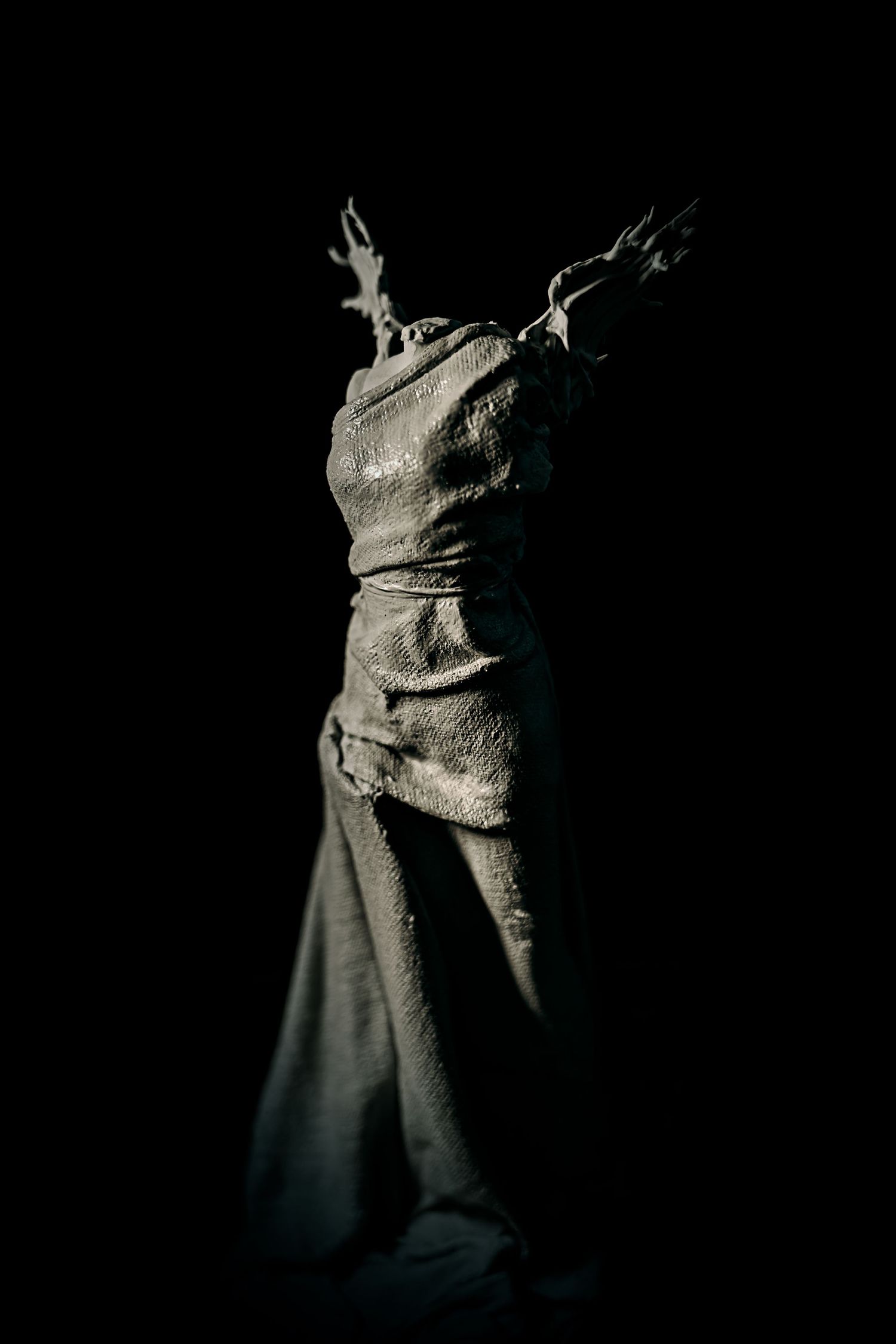 Child’s favourite toy photographed in a studio with dramatic lighting, creating a bold, moody portrait with striking shadows and detail.
