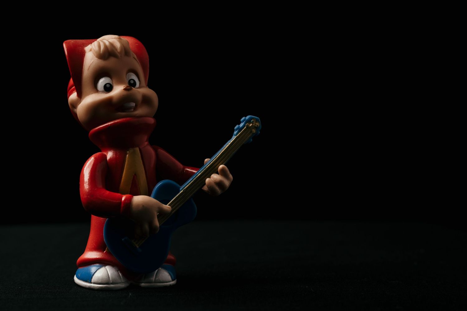 Child’s favourite toy photographed in a studio with dramatic lighting, creating a bold, moody portrait with striking shadows and detail.