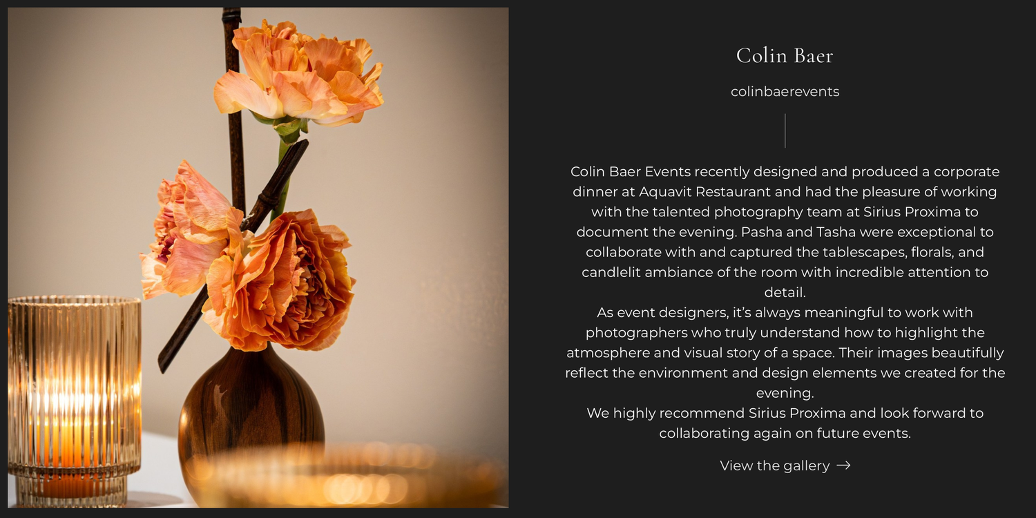 Elegant corporate dinner table setting with orange floral centerpiece and candle, styled by Colin Baer Events at Sioux Roasterie.