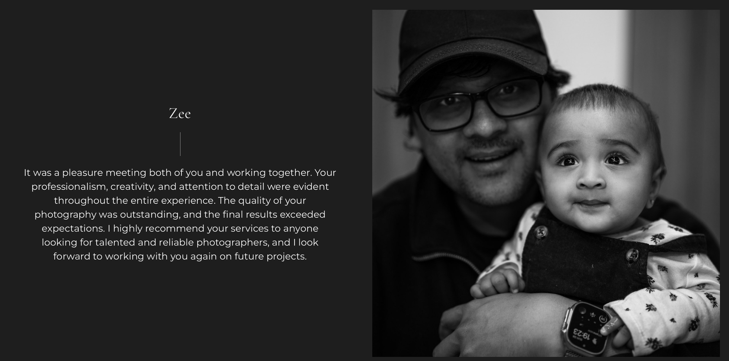 Black and white portrait of a man wearing glasses holding a smiling baby, capturing a tender moment between adult and child.