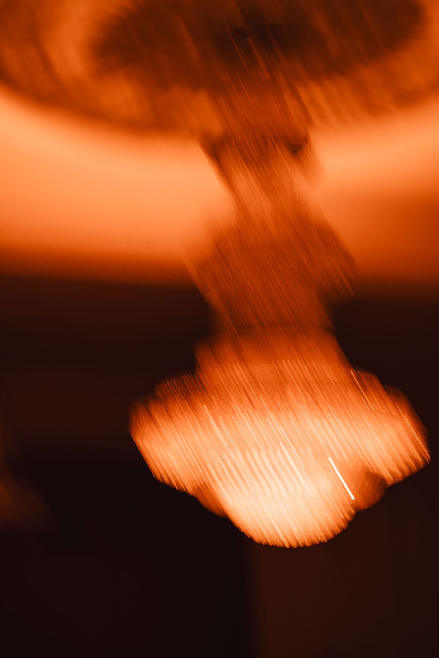 Abstract orange bokeh light blur creating a dramatic artistic photography effect.