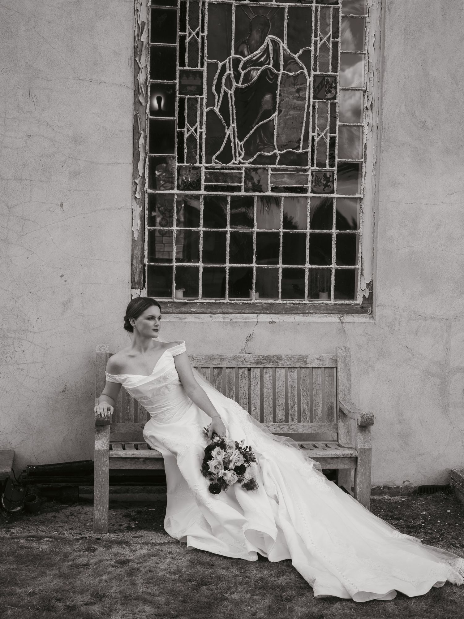 Bride in vintage-inspired wedding dress outside a church