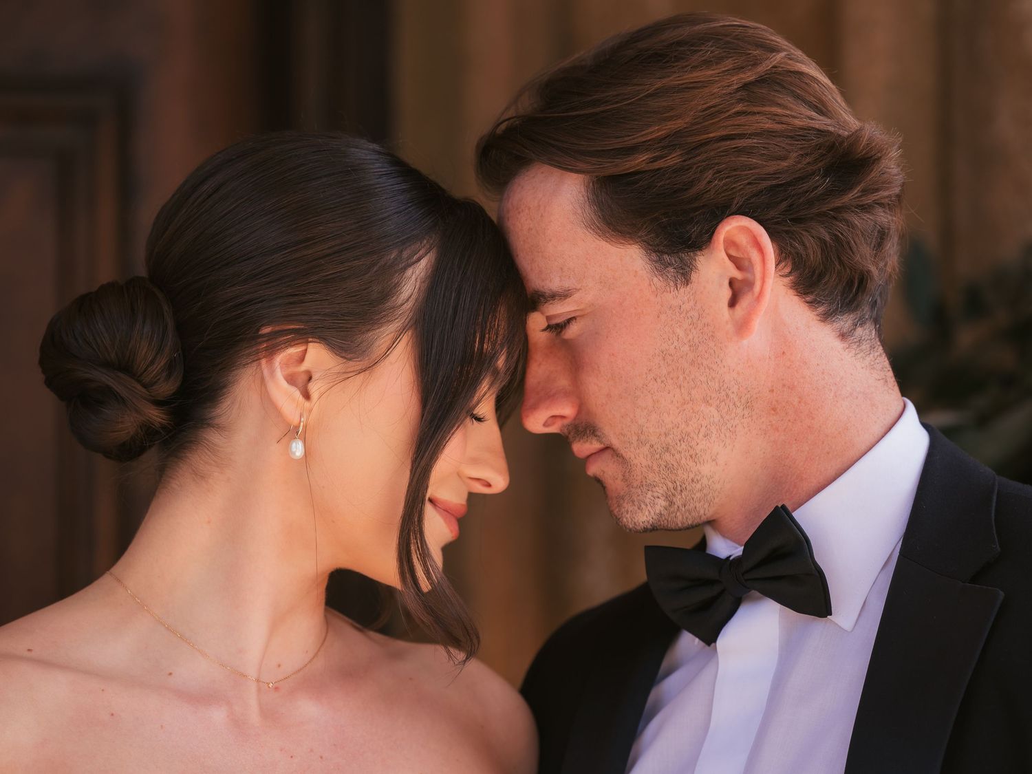Bride and groom intimate moment foreheads together