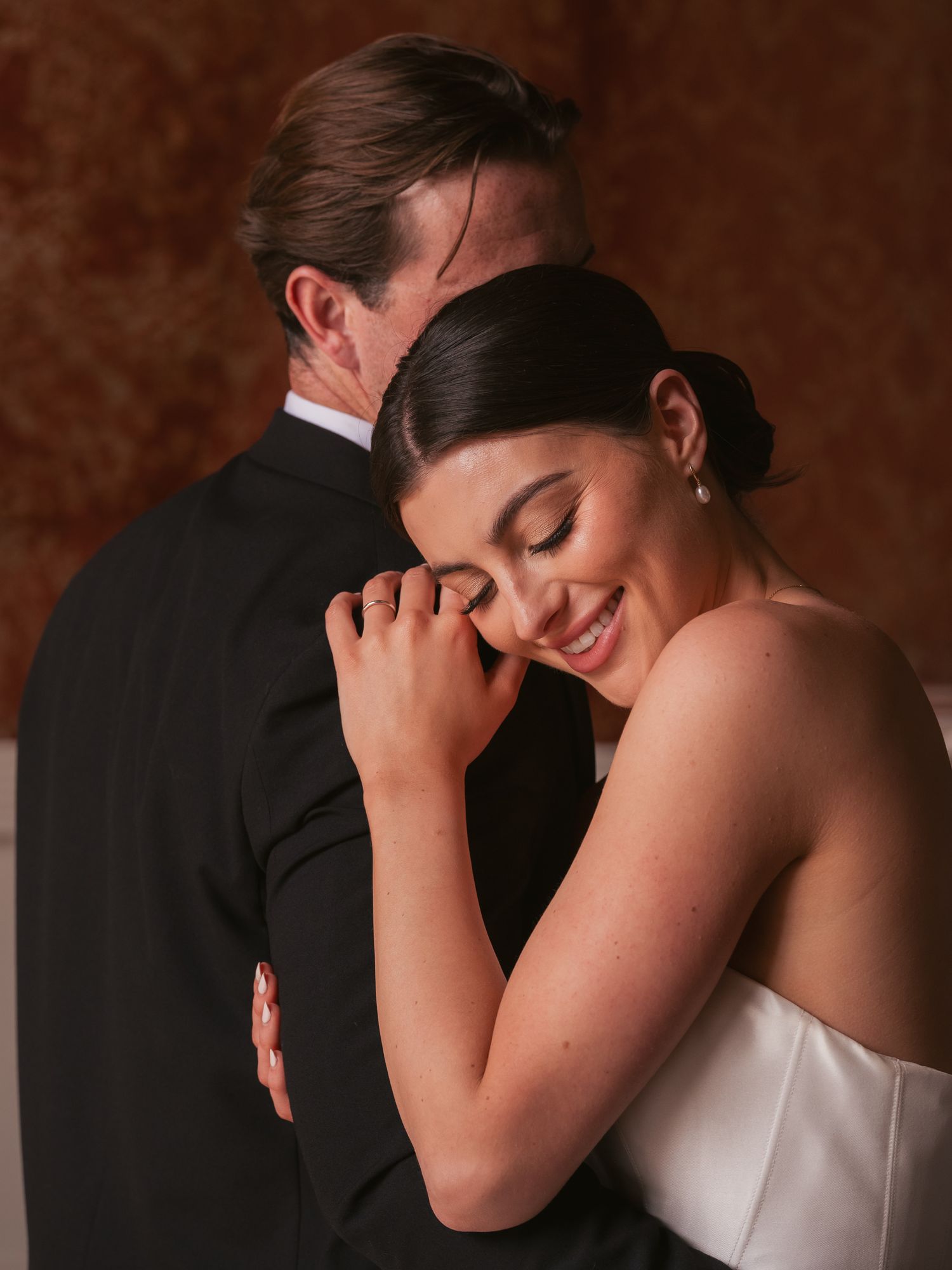 Editorial newly wed couple embracing