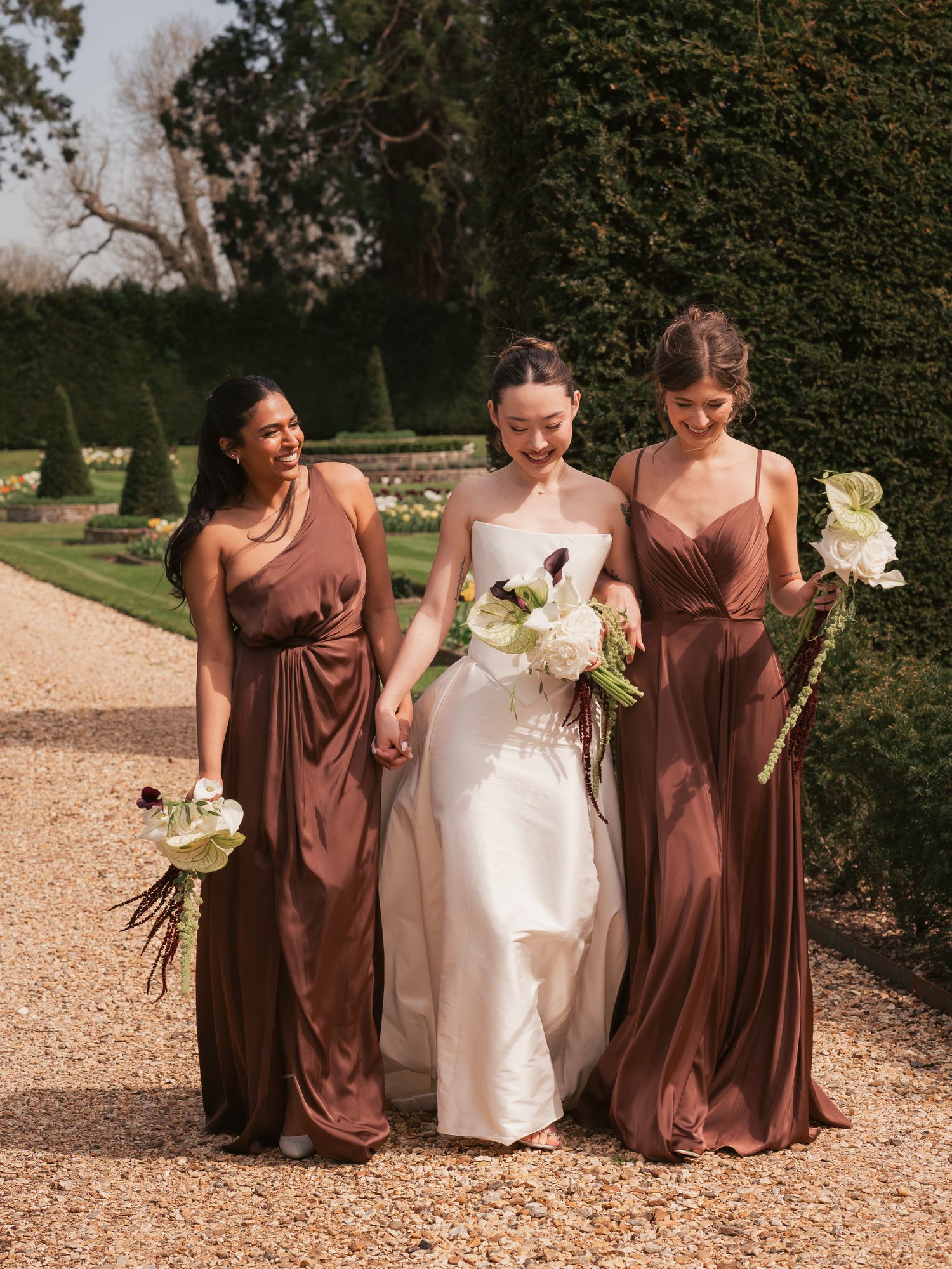 Bride and bridesmaids walking together