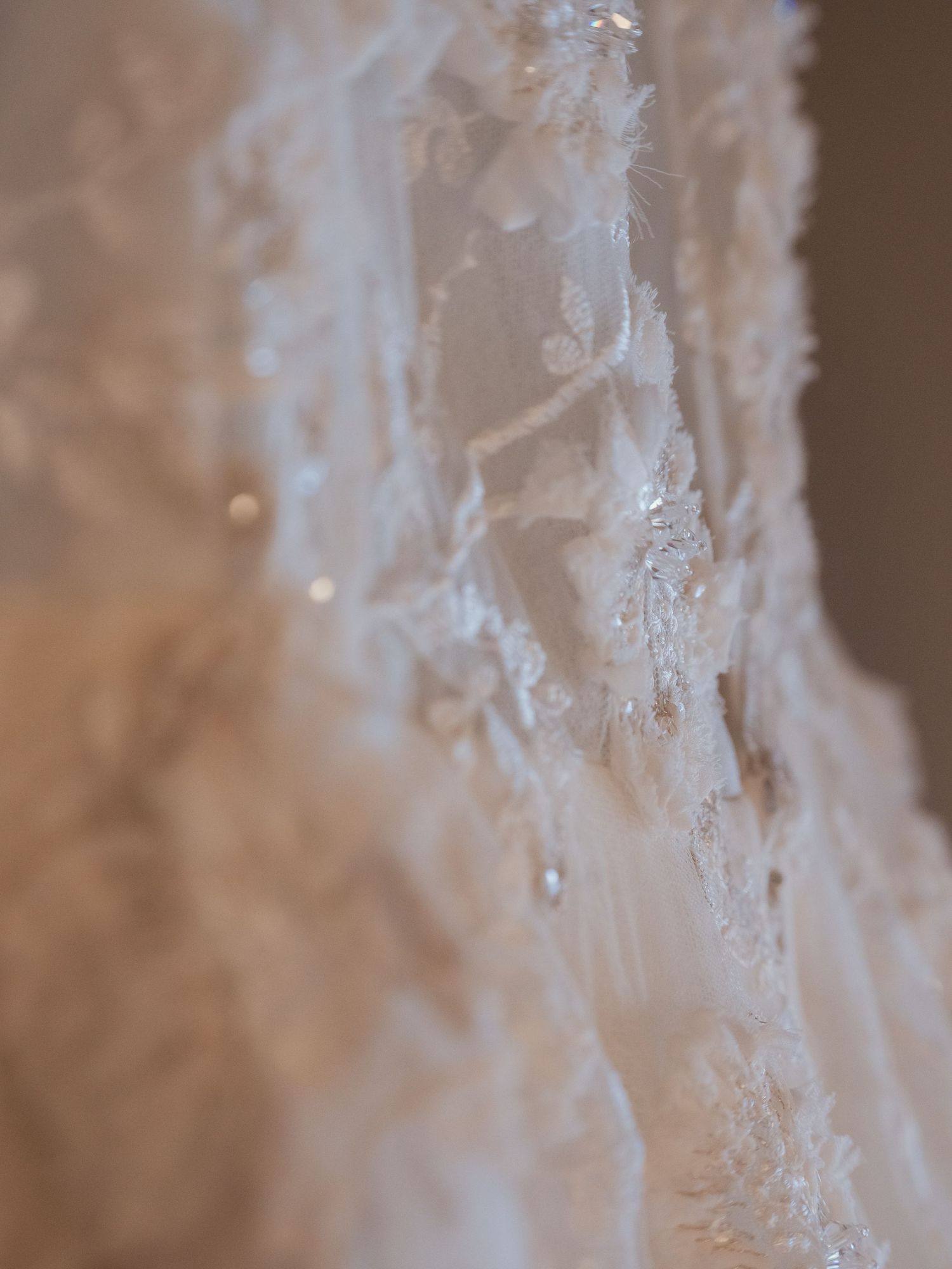 Close up of wedding dress by Watters
