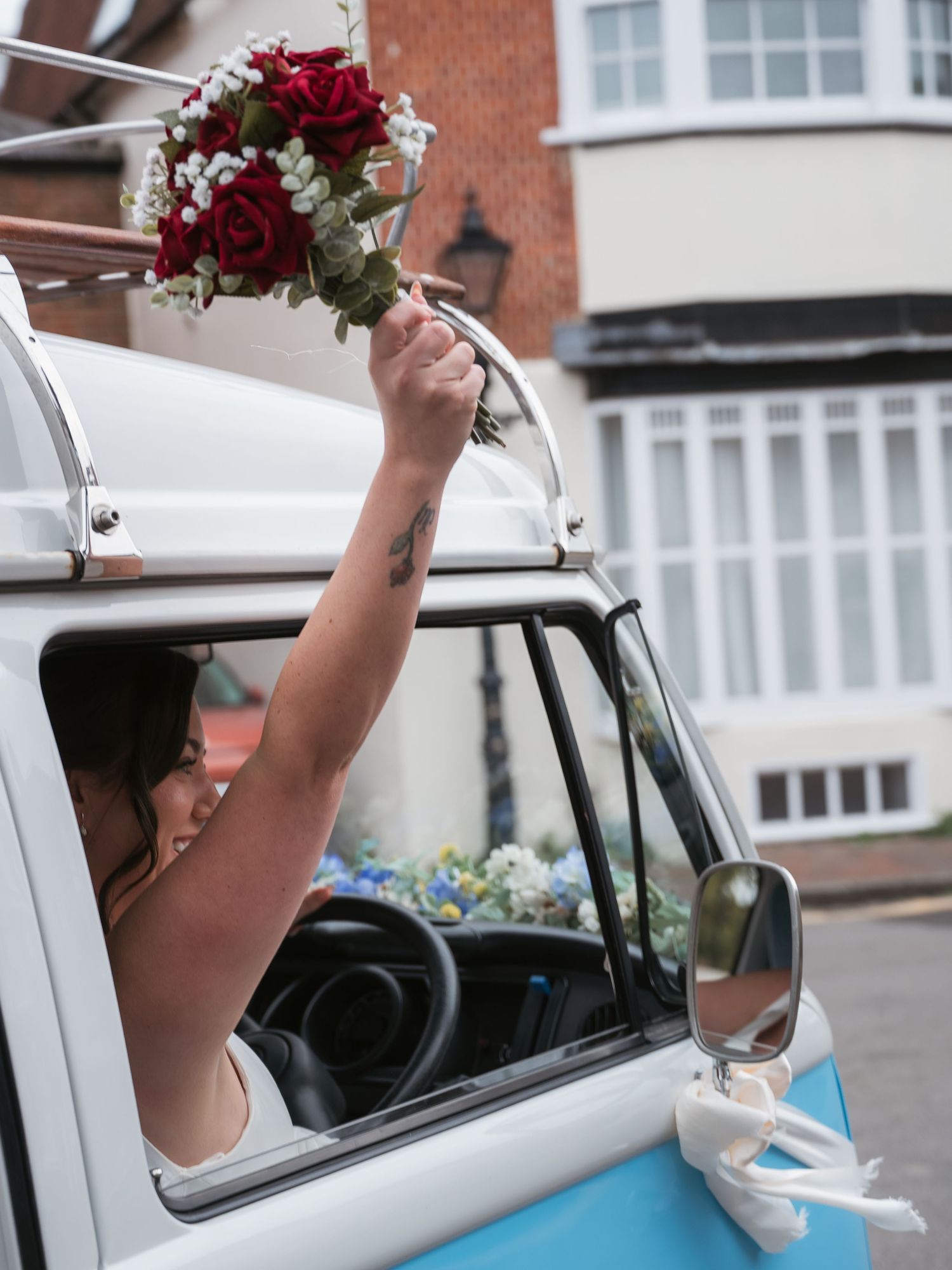 Bridal celebrations - holding bouquet up
