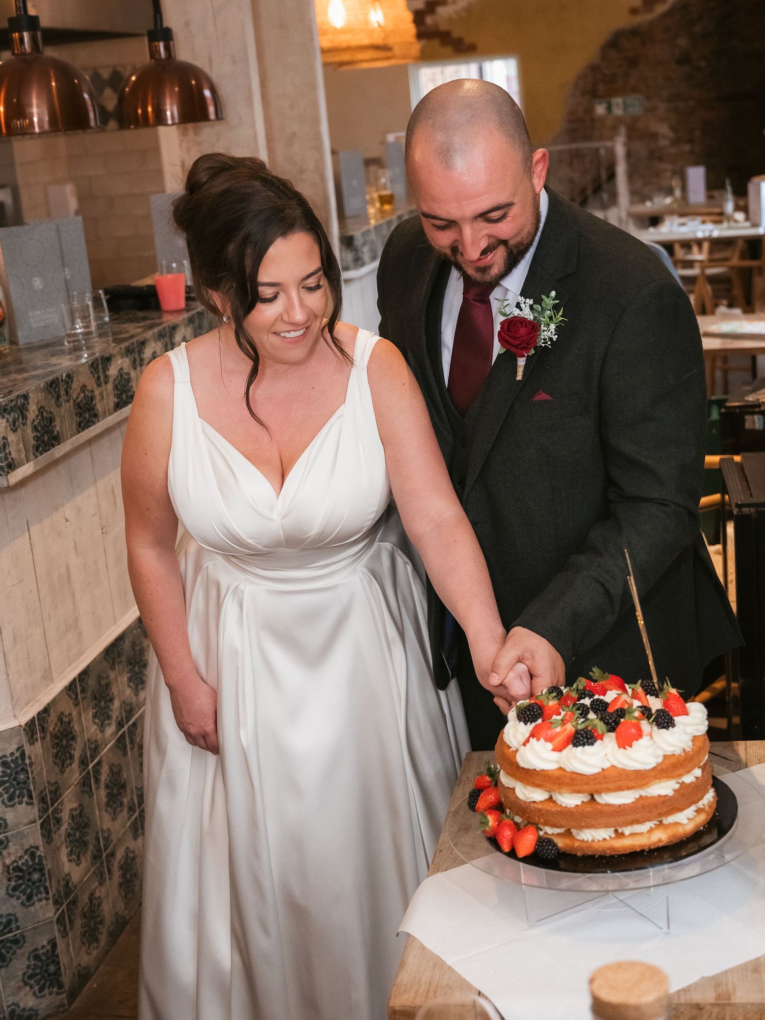 Bride and groom cutting their cake