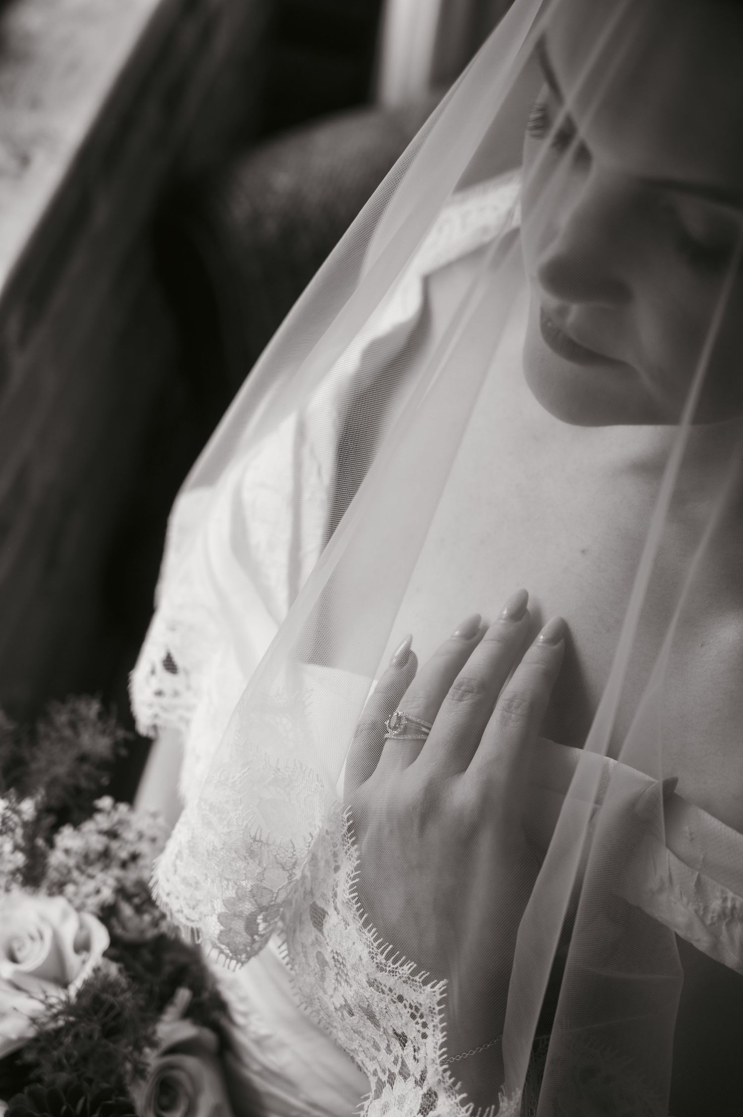 Stunning bridal veil portrait showing ring