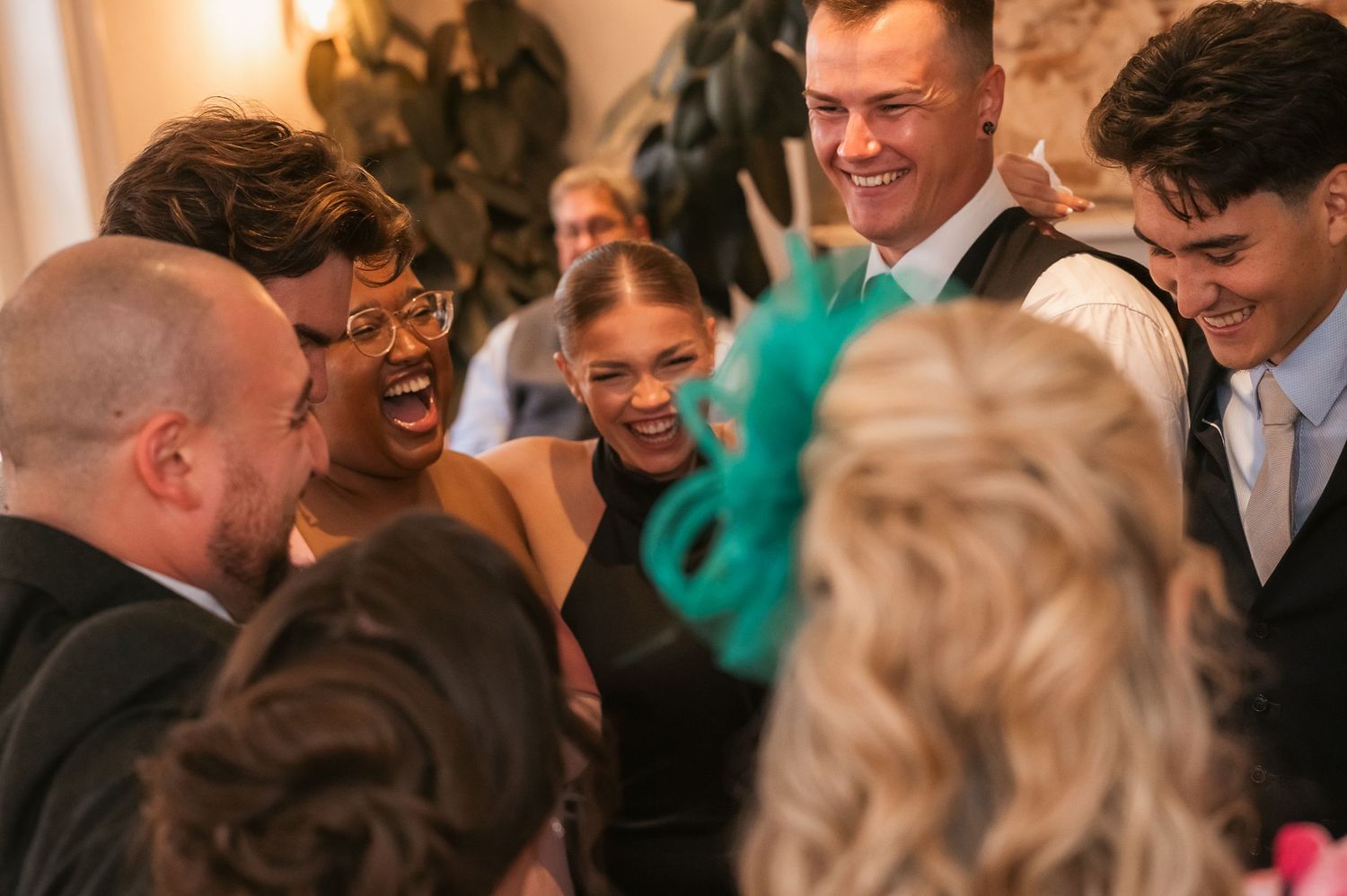 Group photo of wedding party laughing