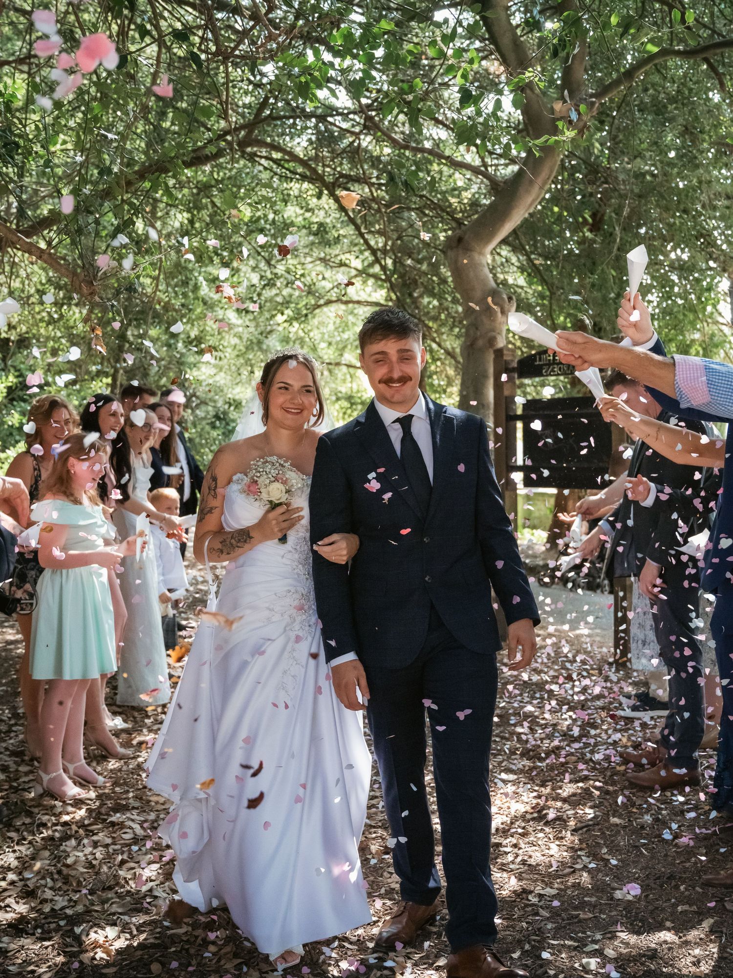 Confetti shot of newly wed couple