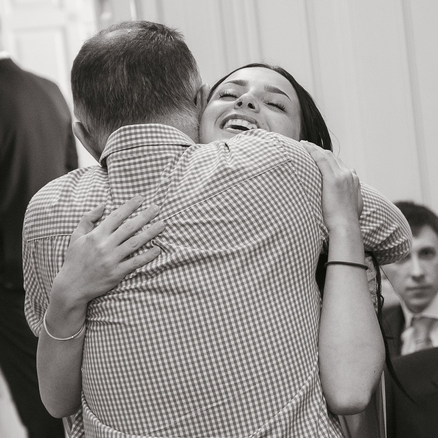 Grandfather and granddaughter embracing