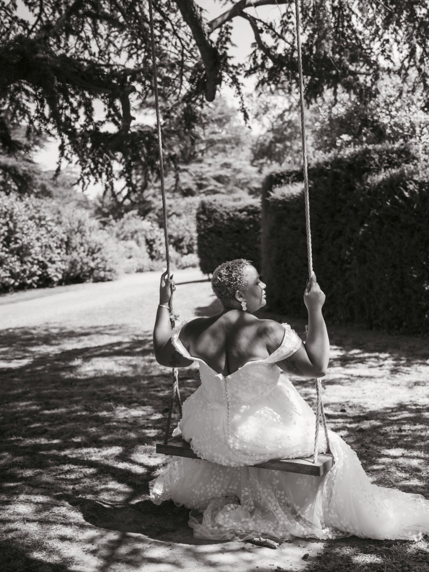 Bride portrait editorial sitting on swing