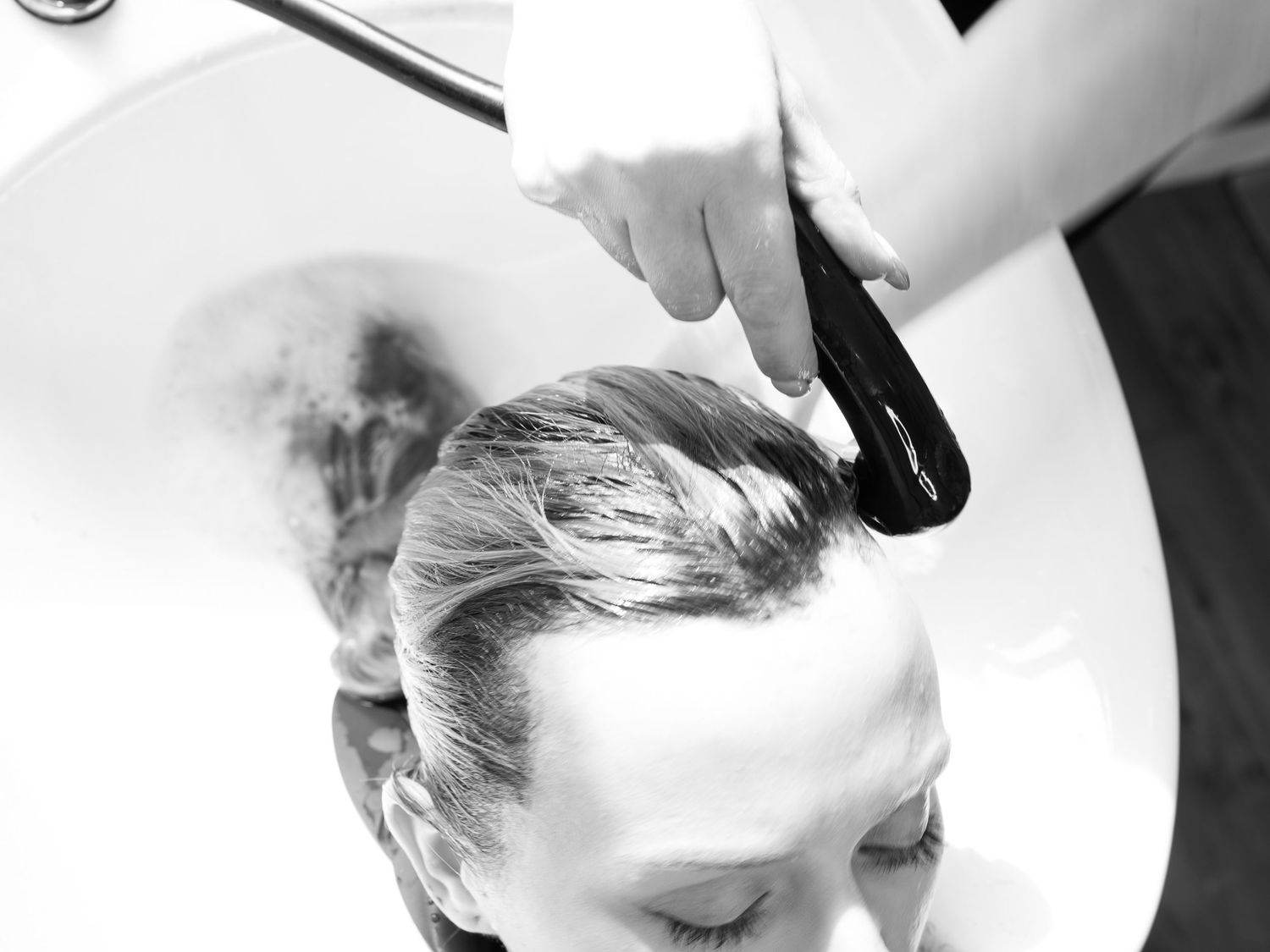 hairdresser close up of washing hair