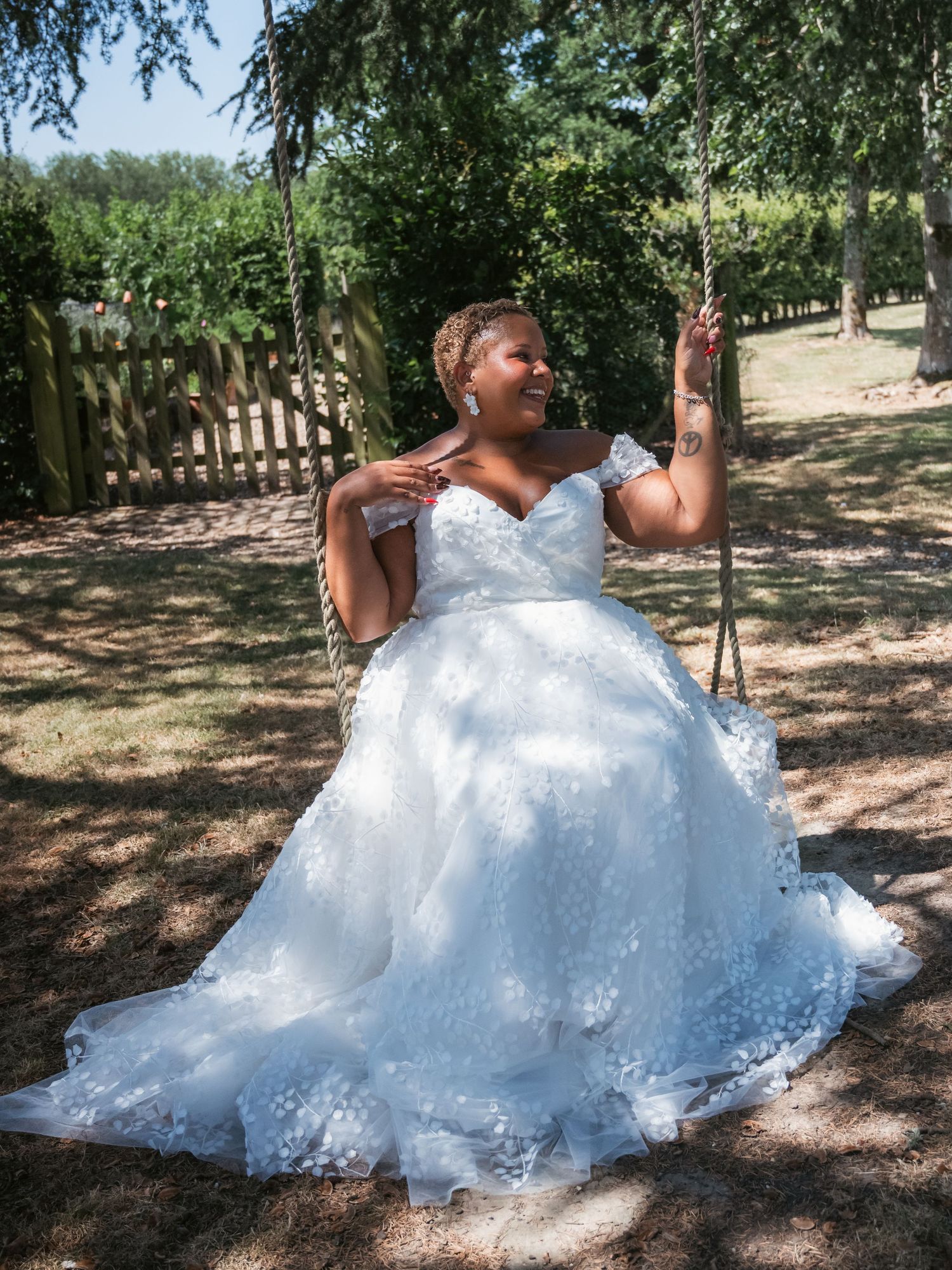 Bride portrait editorial sitting on swing
