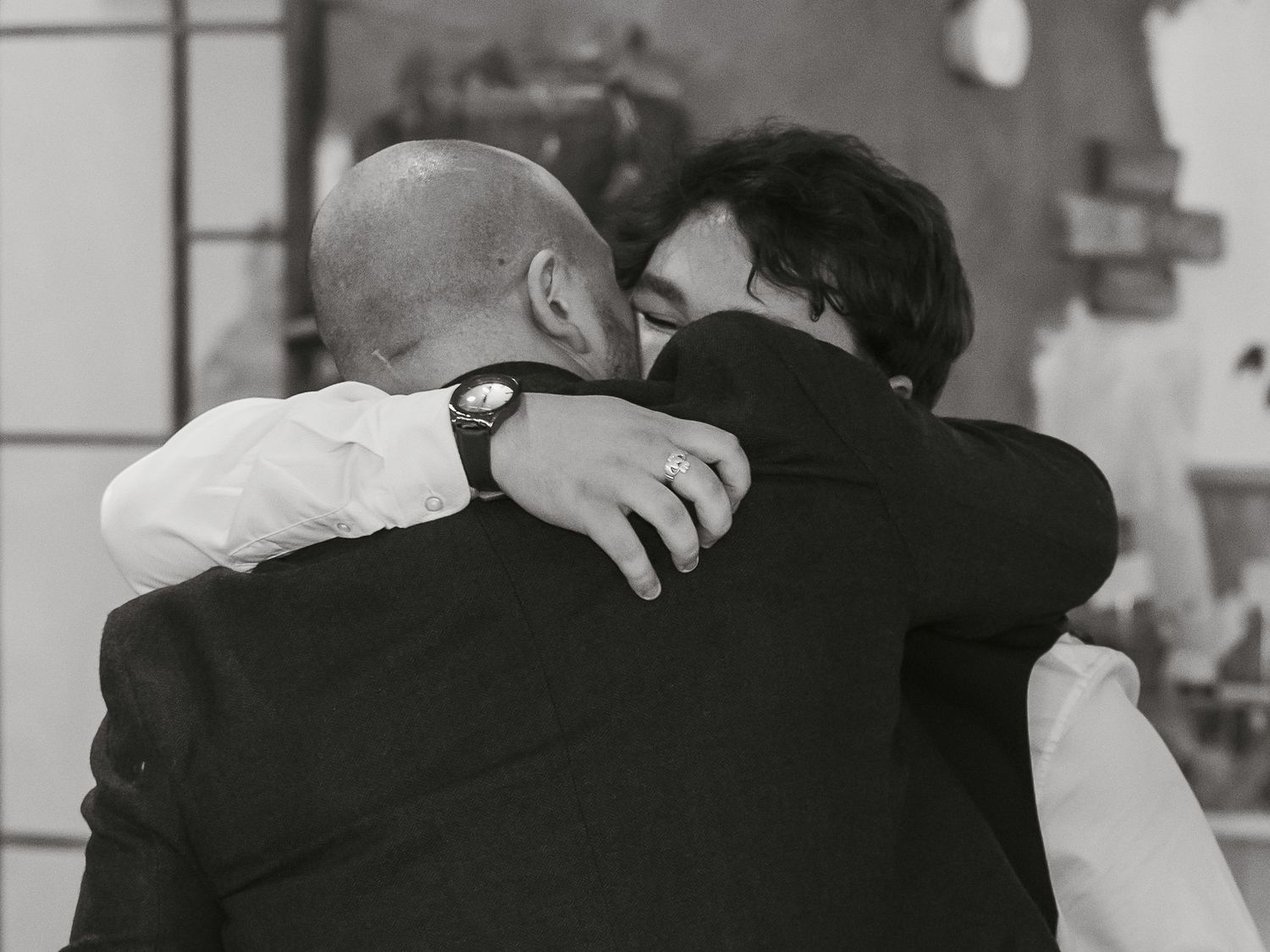 Groom hugging his brother after speech