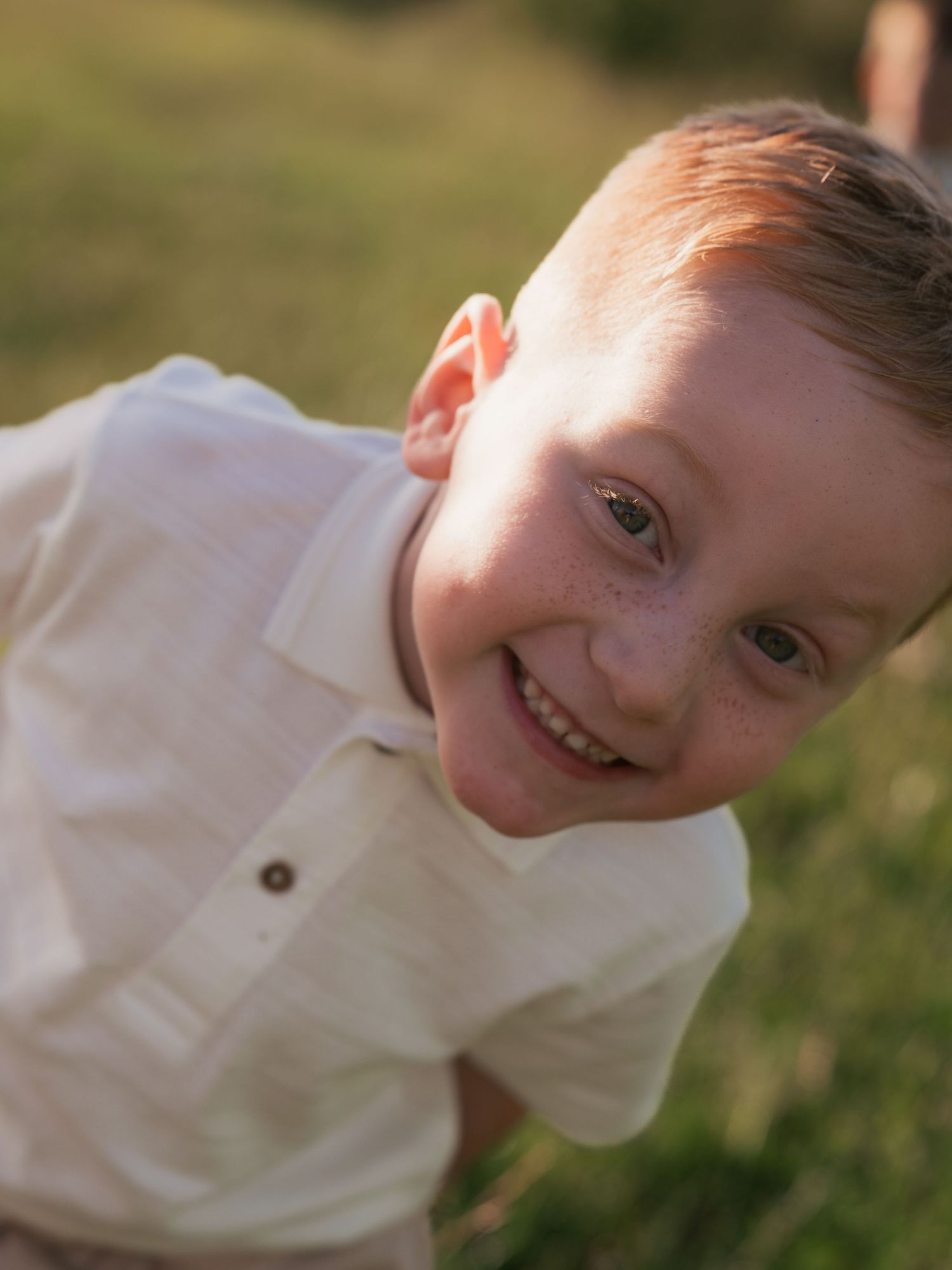 Child smiling directly at camera