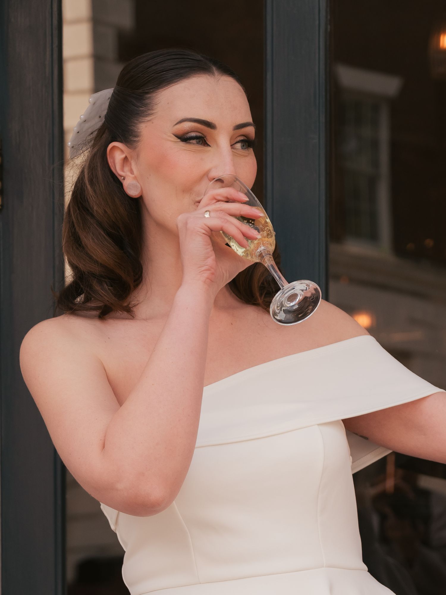 Bridal portrait editorial, drinking champagne at reception