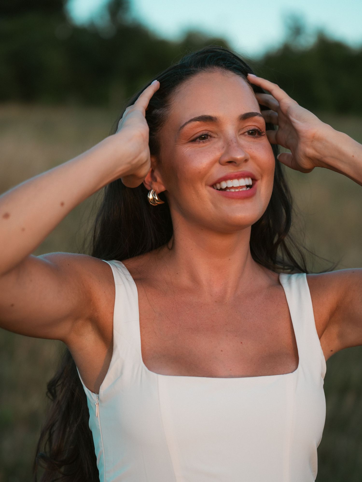 Candid of woman fixing her hair