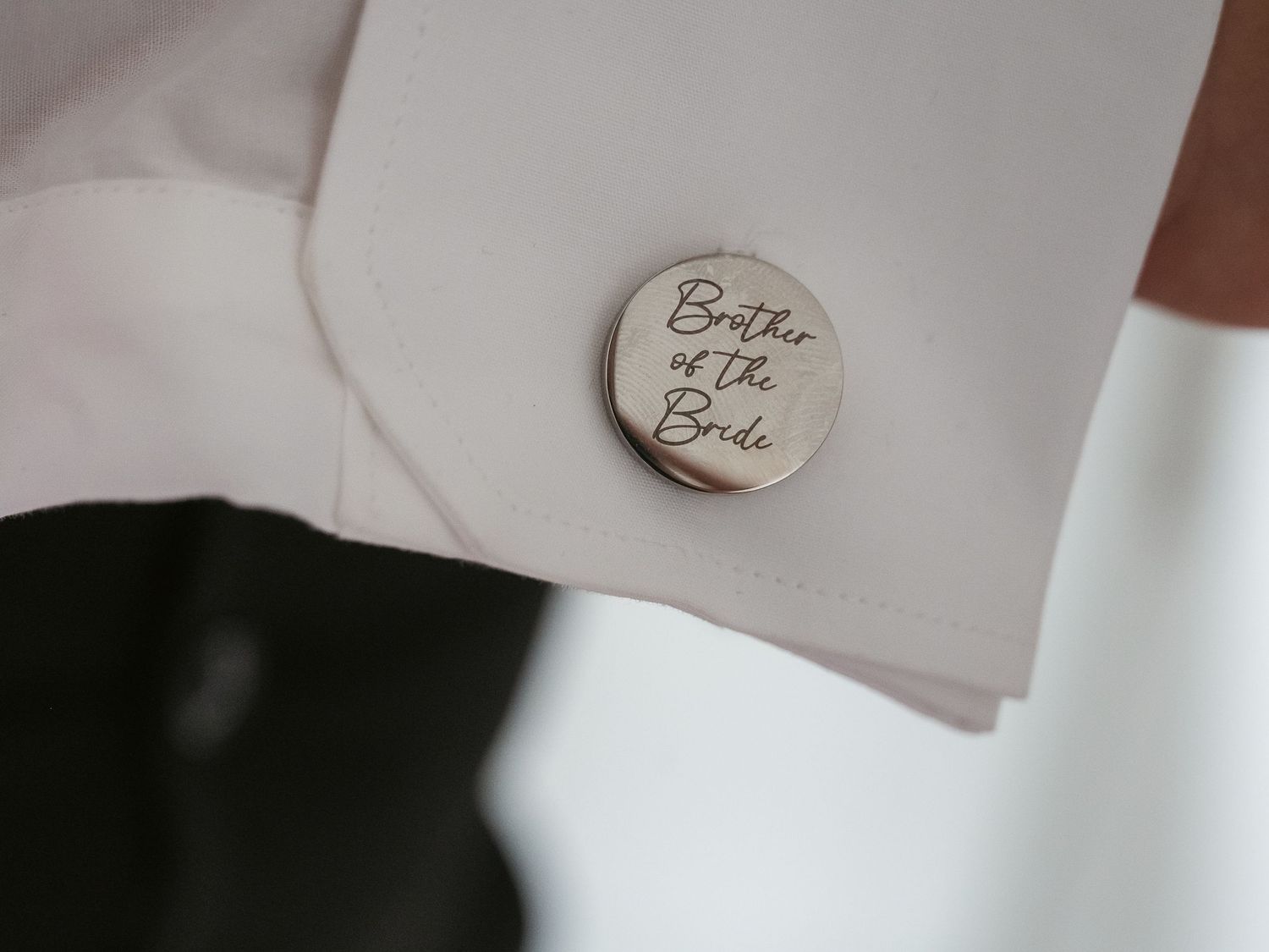 Detail of cufflink gift from bride to brother