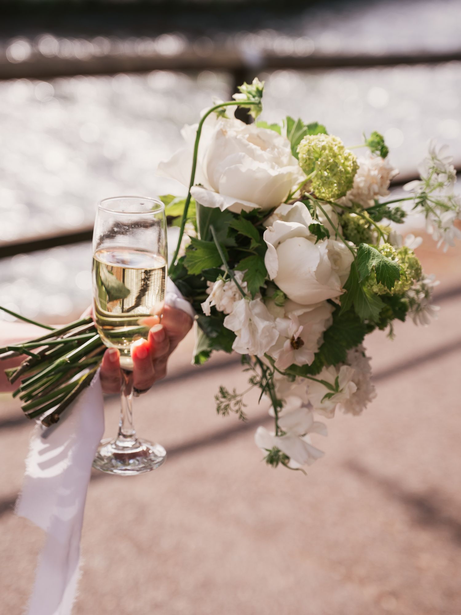Bouquet and champagne by the river