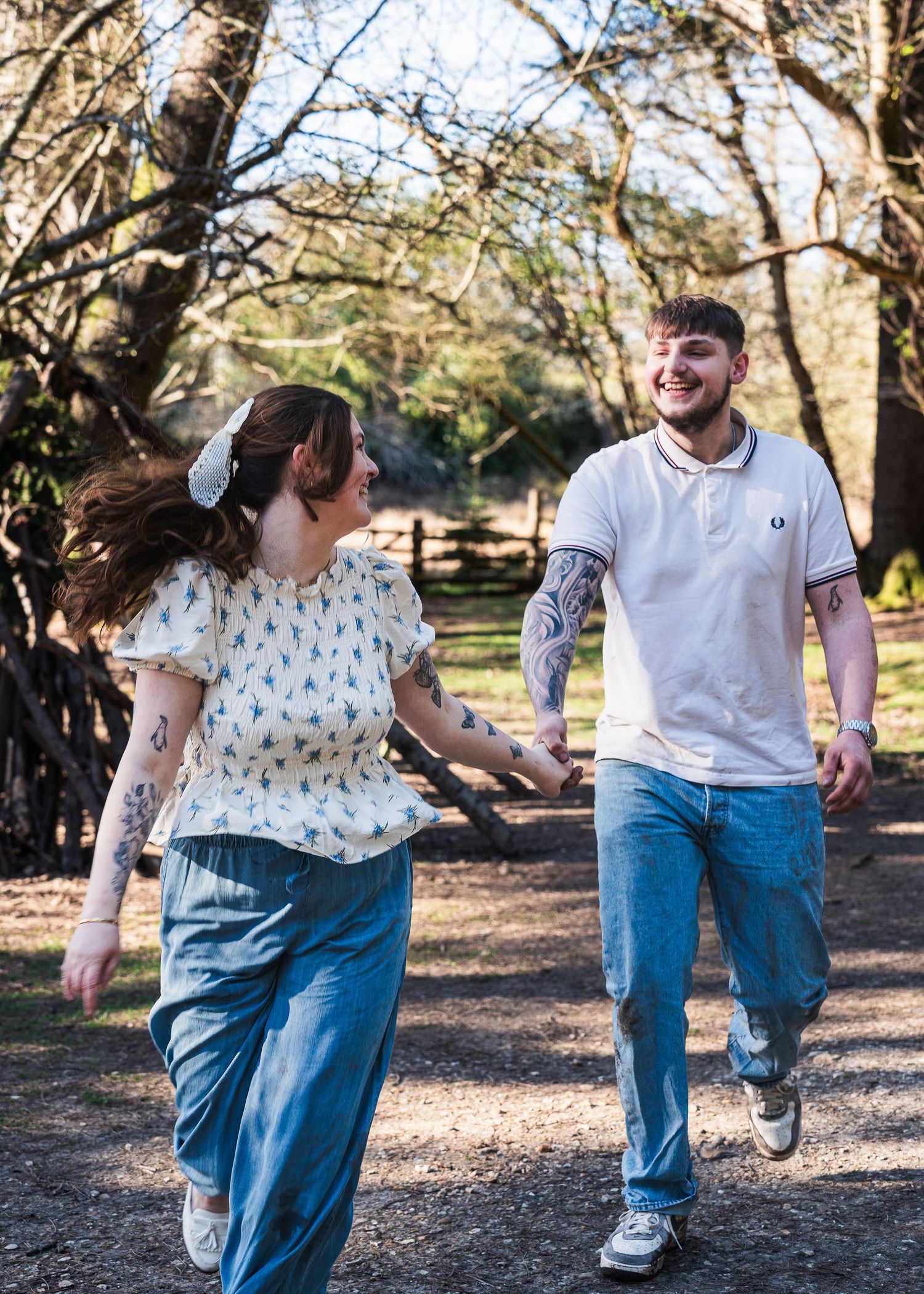 Couple running in the forest