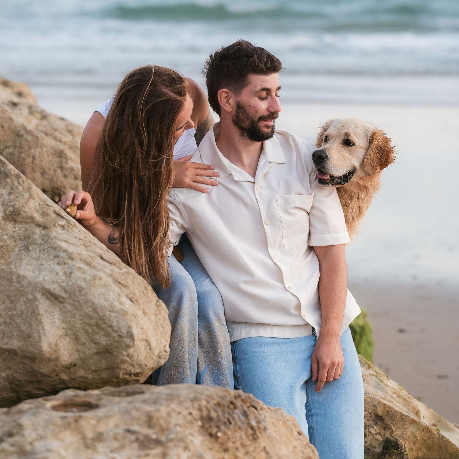 Couple at the beach with their dog