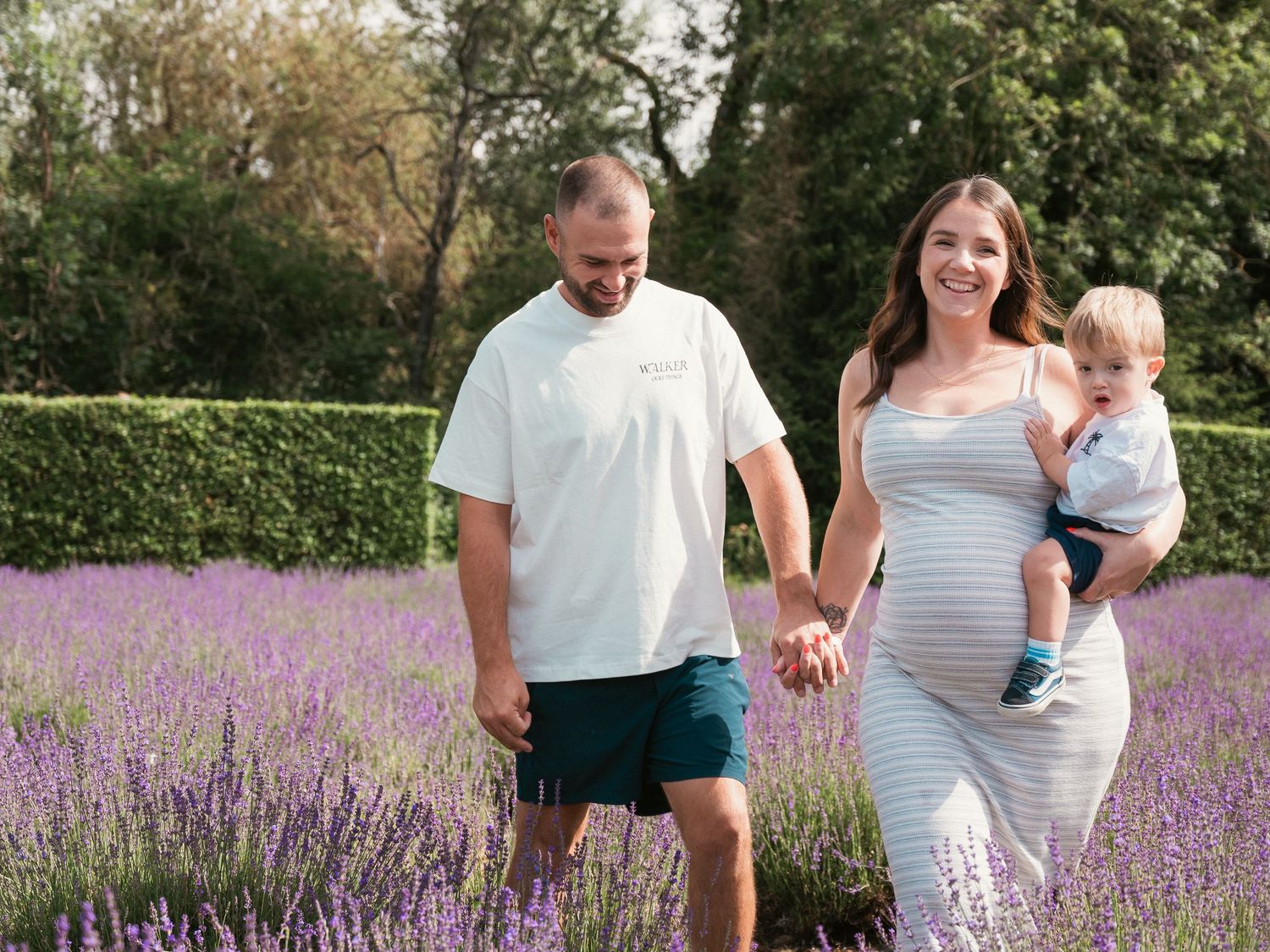 Family walking along lavender
