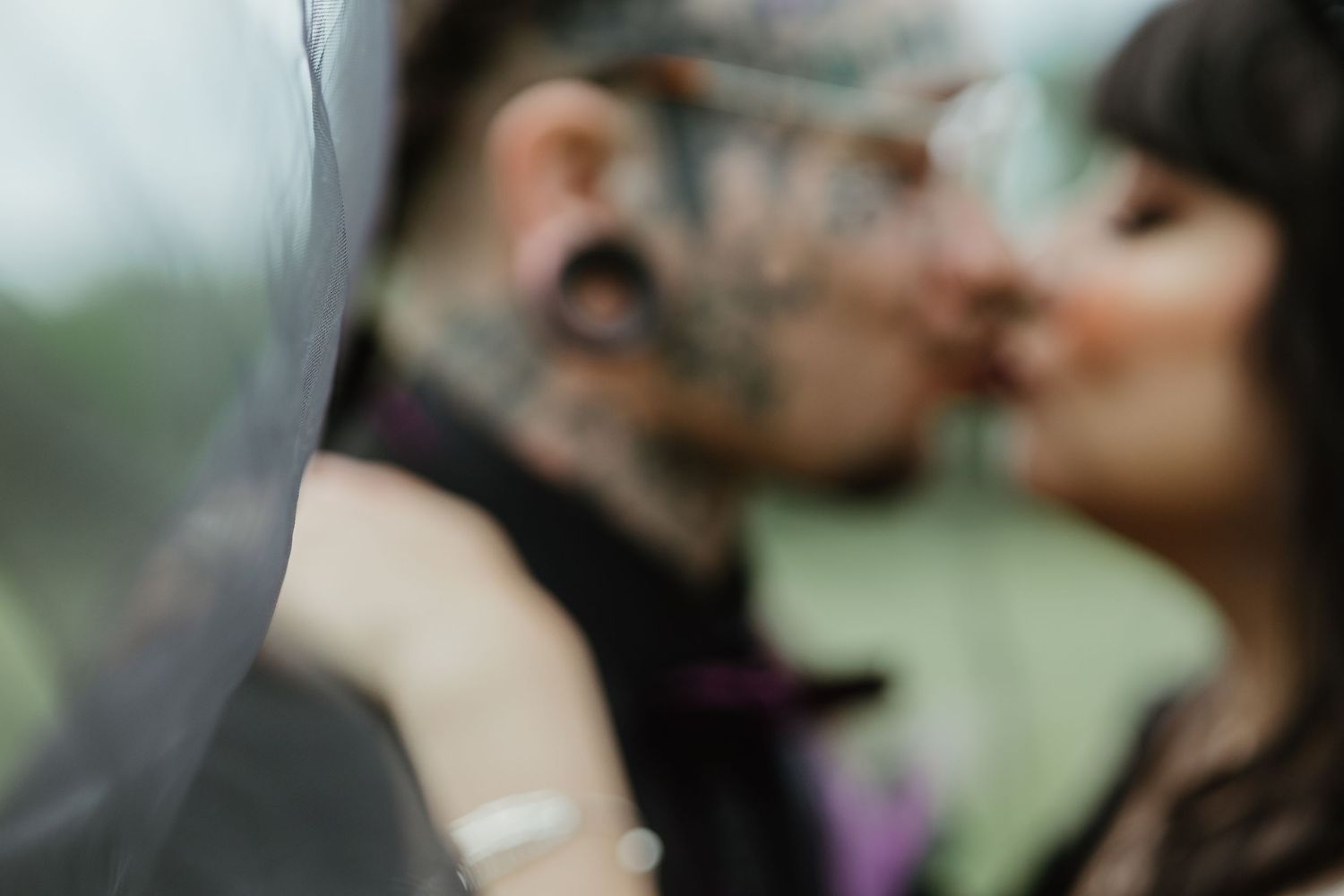 Intimate close-up portrait of a couple embracing outdoors