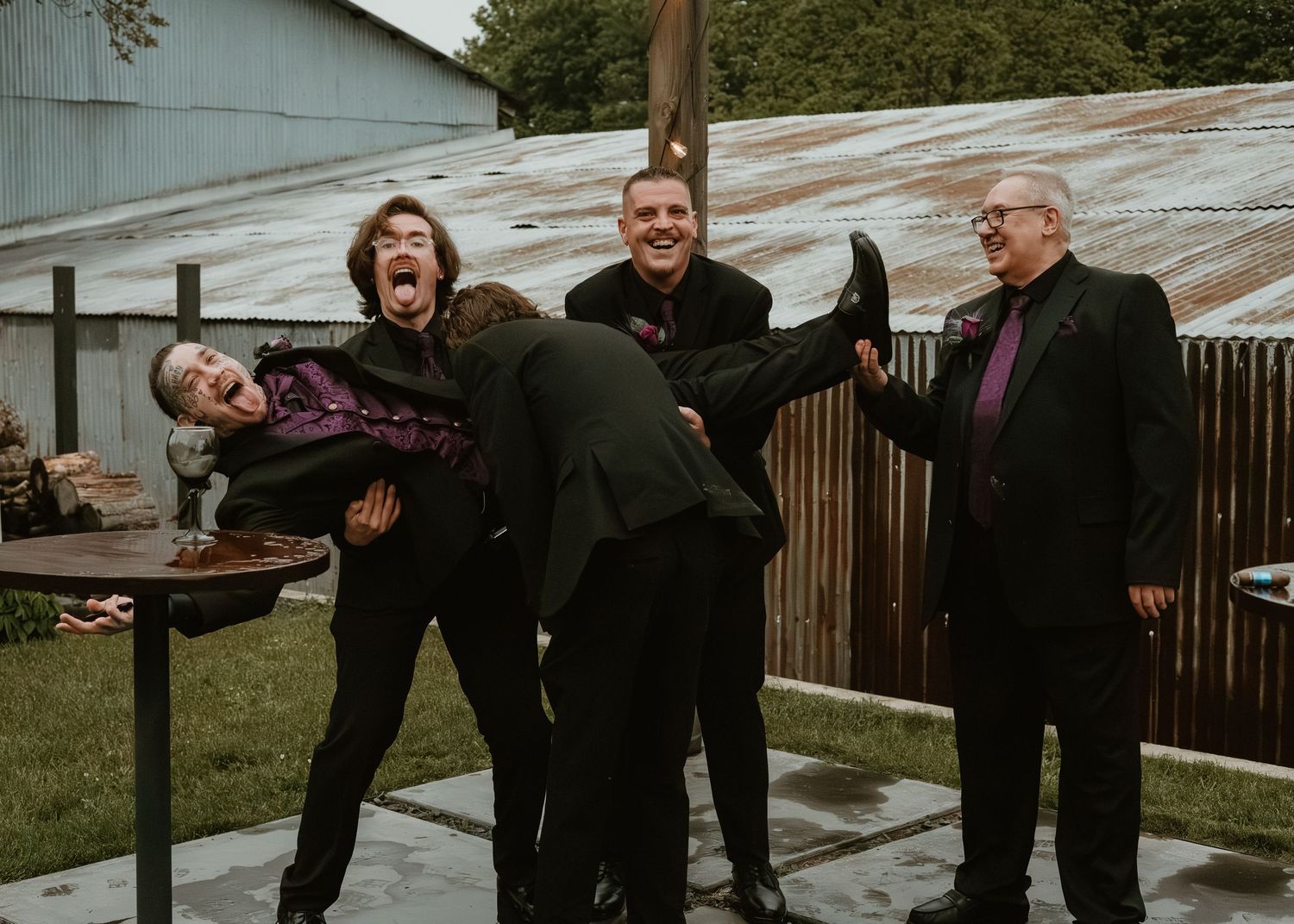 Playful group portrait of friends laughing together outdoors
