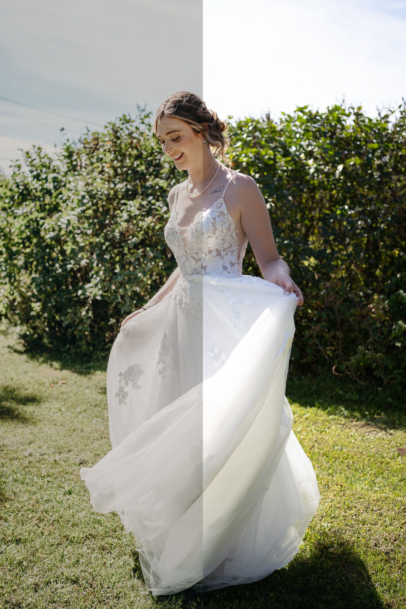 Bride in flowy white lace A-line wedding dress twirling outdoors near green hedges on a sunny day.