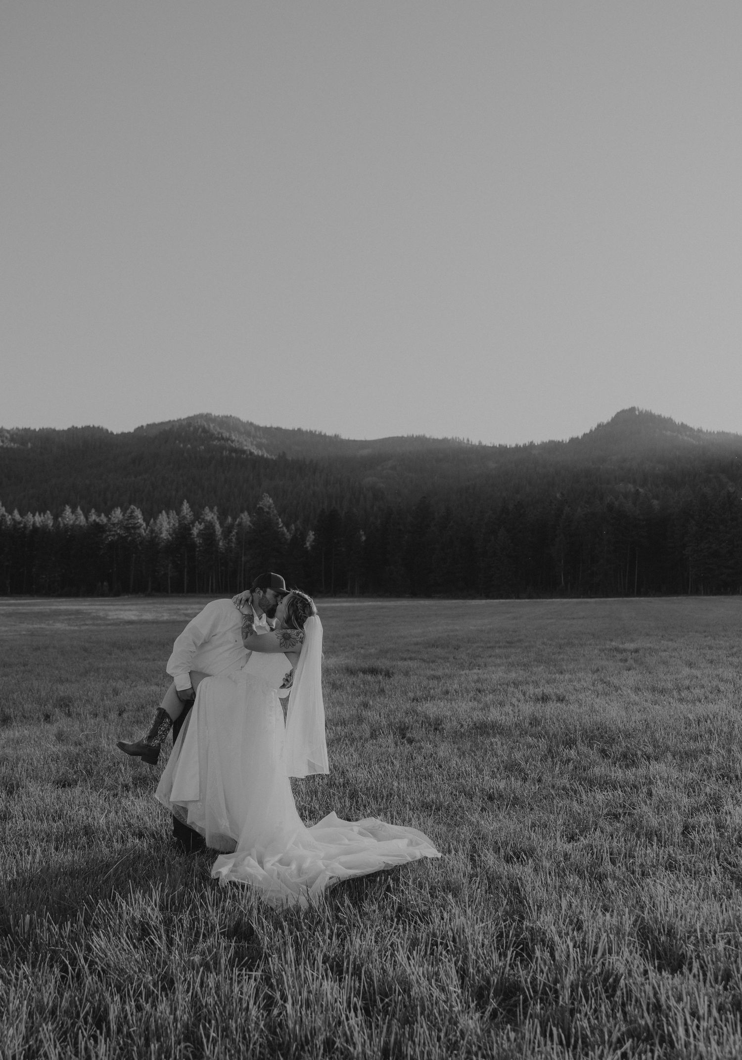 Romantic black and white wedding portrait in Oregon mountain field, timeless natural photography