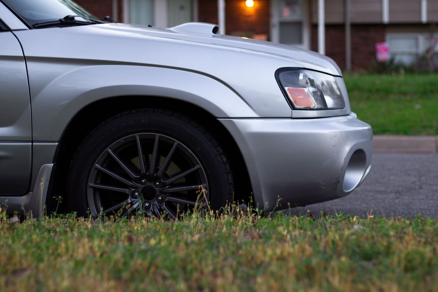 Front end of a silver Subaru Forester XT.