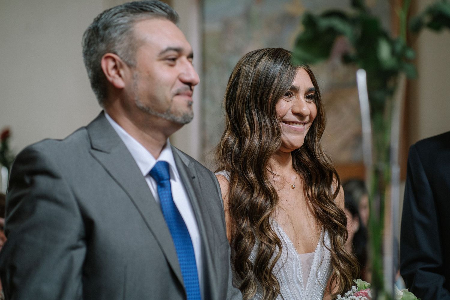 A couple shares a joyful moment during their wedding ceremony.