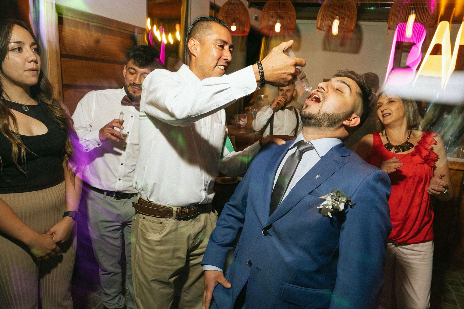 Guests participate in a fun party game during the wedding reception celebrations.