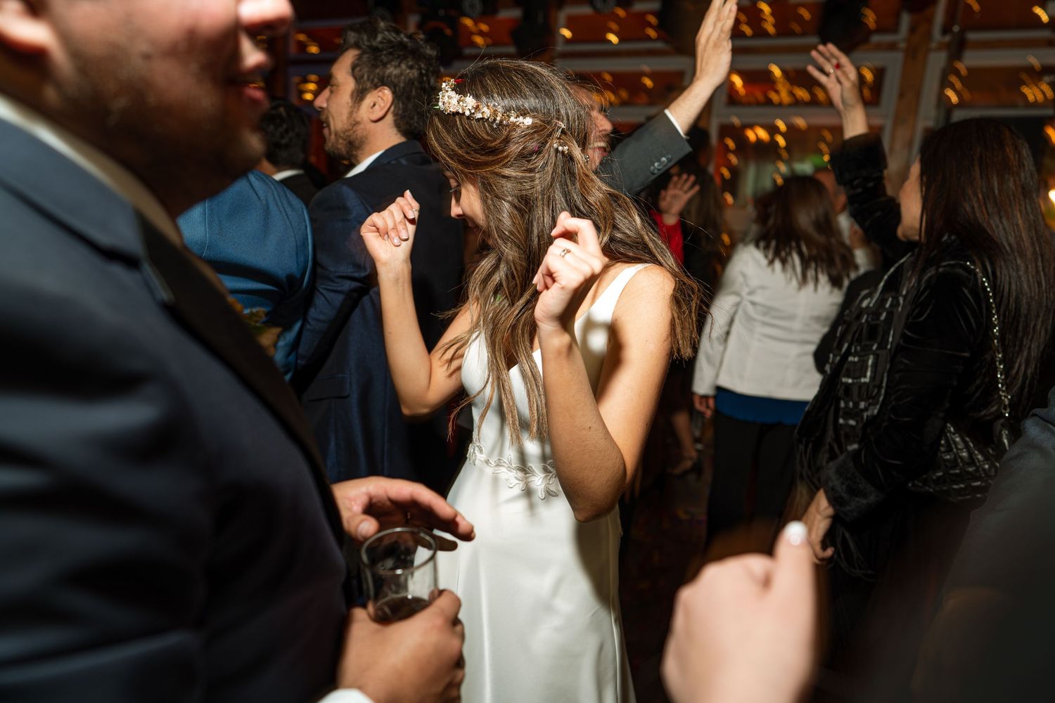 Wedding reception dance floor filled with guests enjoying the celebration.