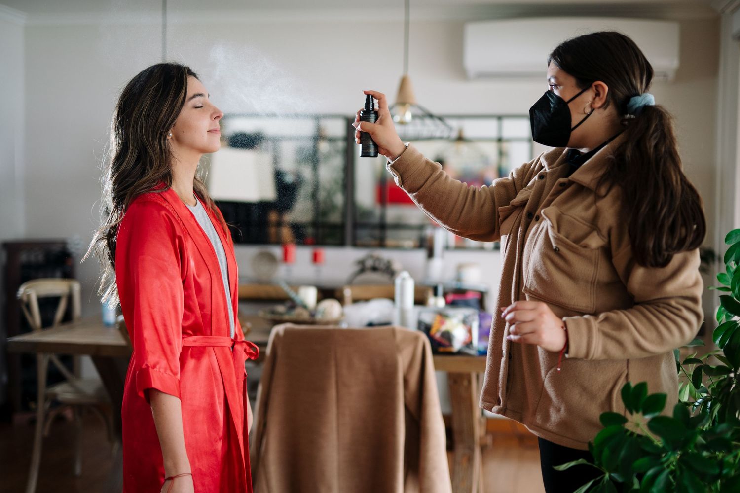 A styling session in progress with someone in red getting their photo taken.