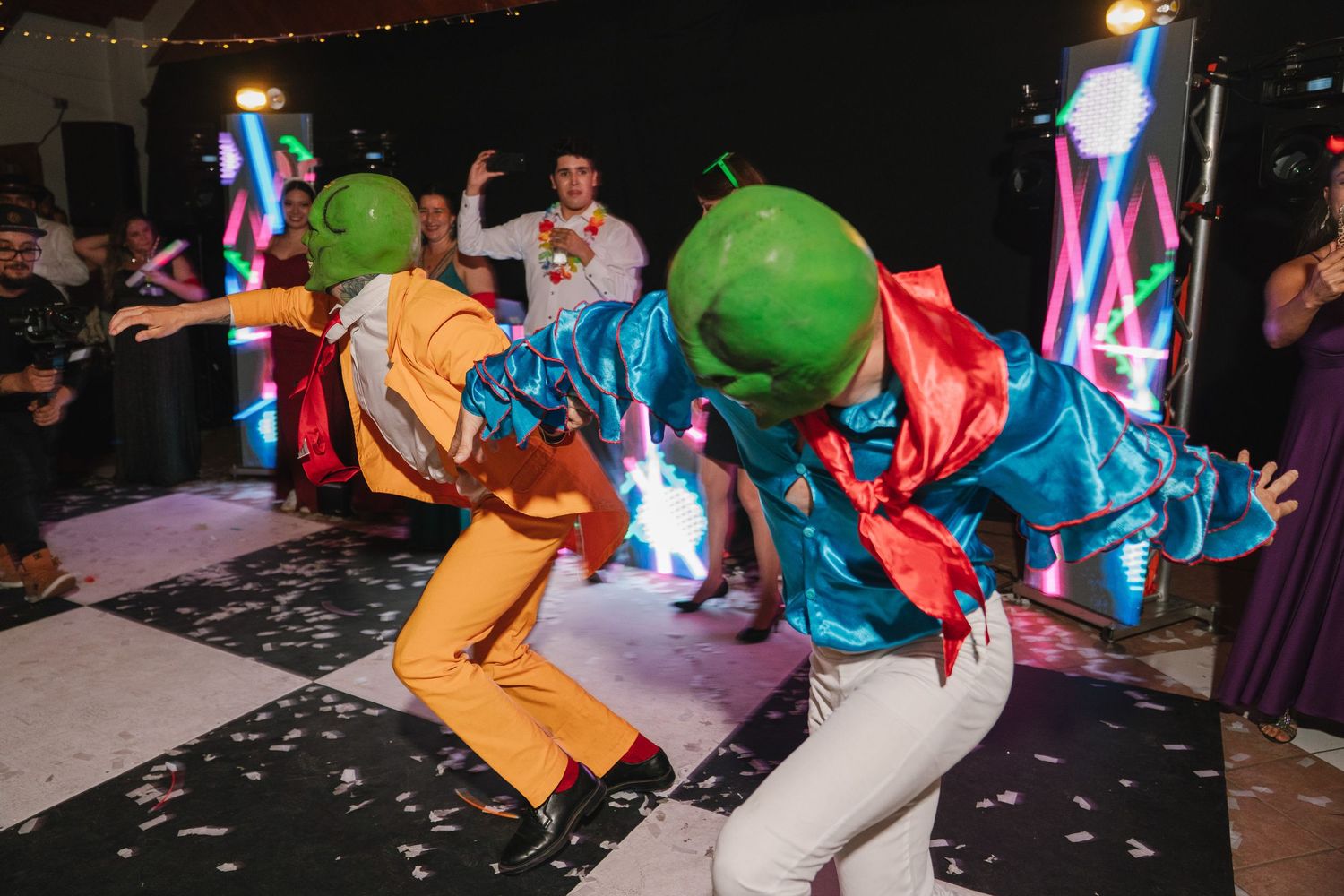 Wedding reception dance floor with colorful balloons and confetti creating a festive party atmosphere.