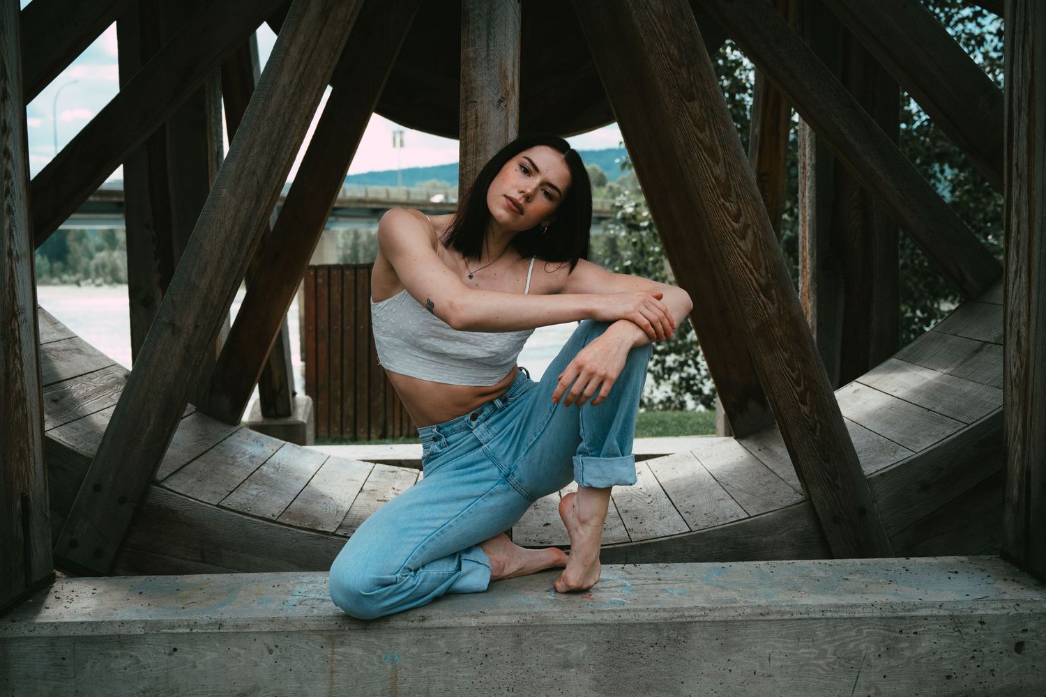 A dancer posed on a water wheel.