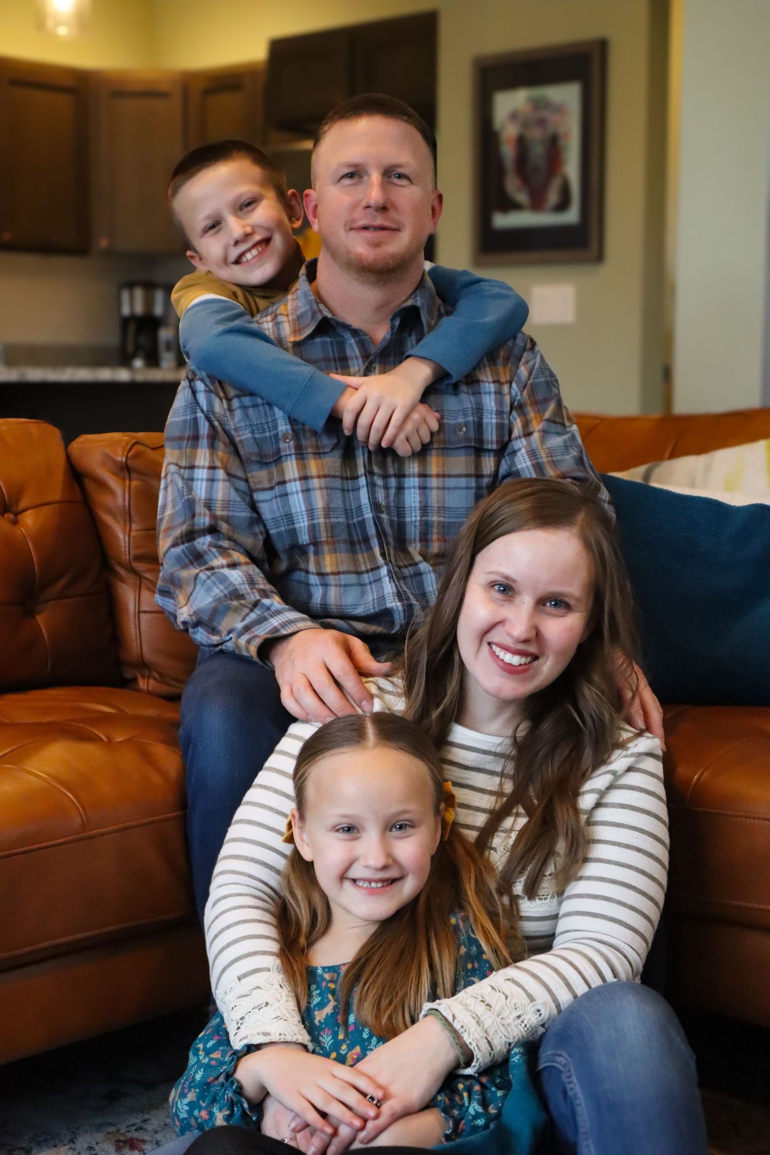 family photo of four, one boy and one girl