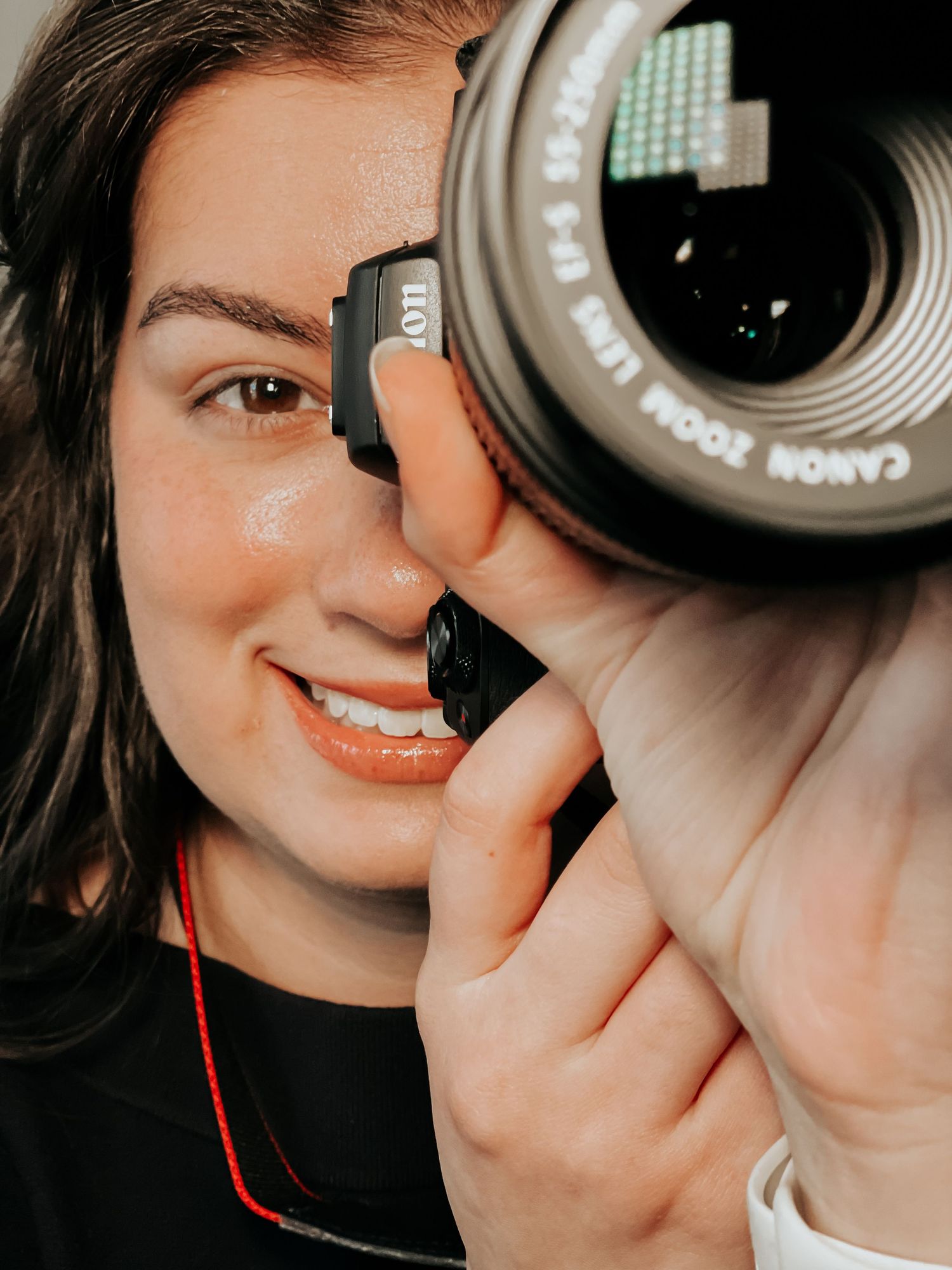 sun prairie photographer, sitting and holding a camera