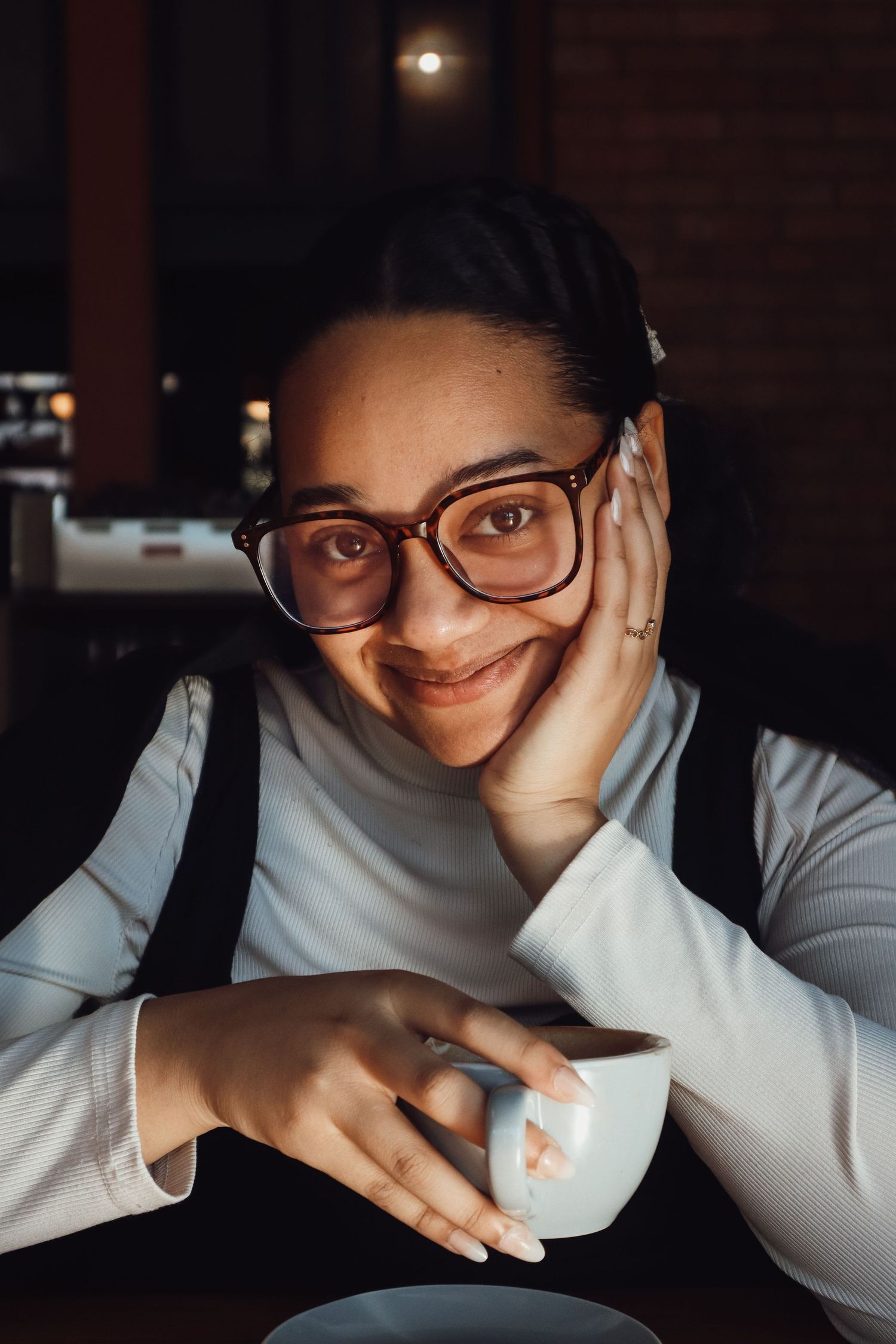 female sitting in a coffee shop