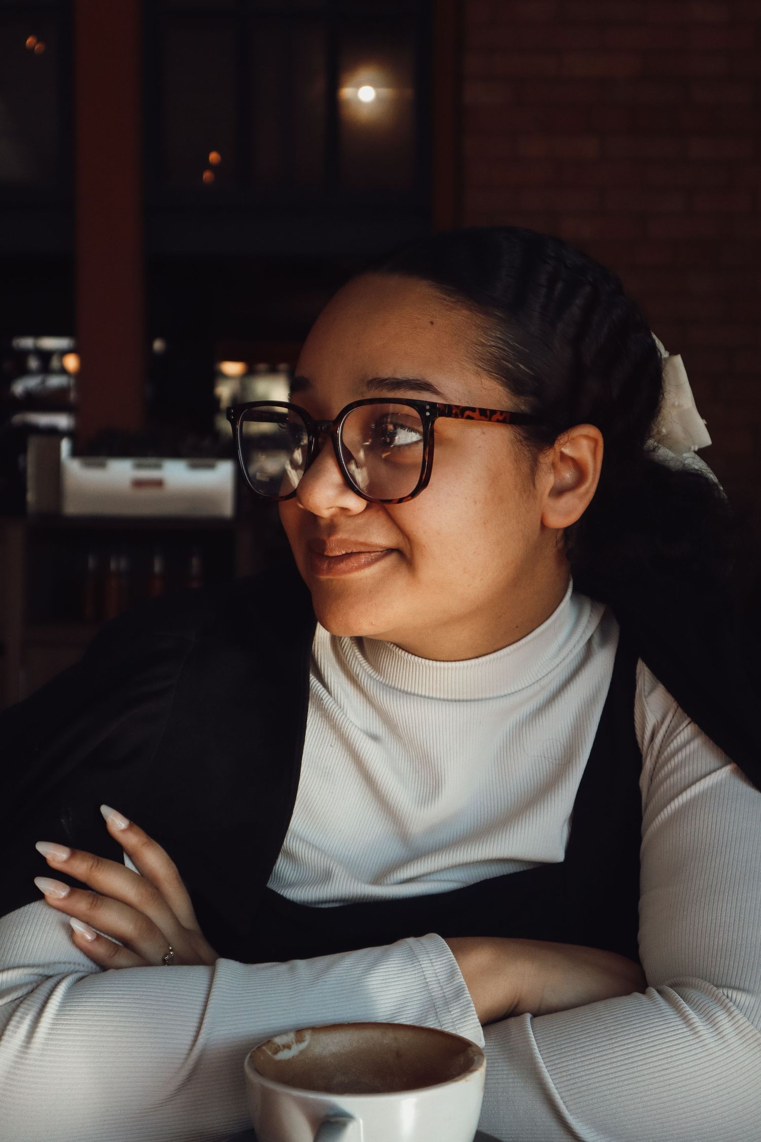 female sitting in a coffee shop
