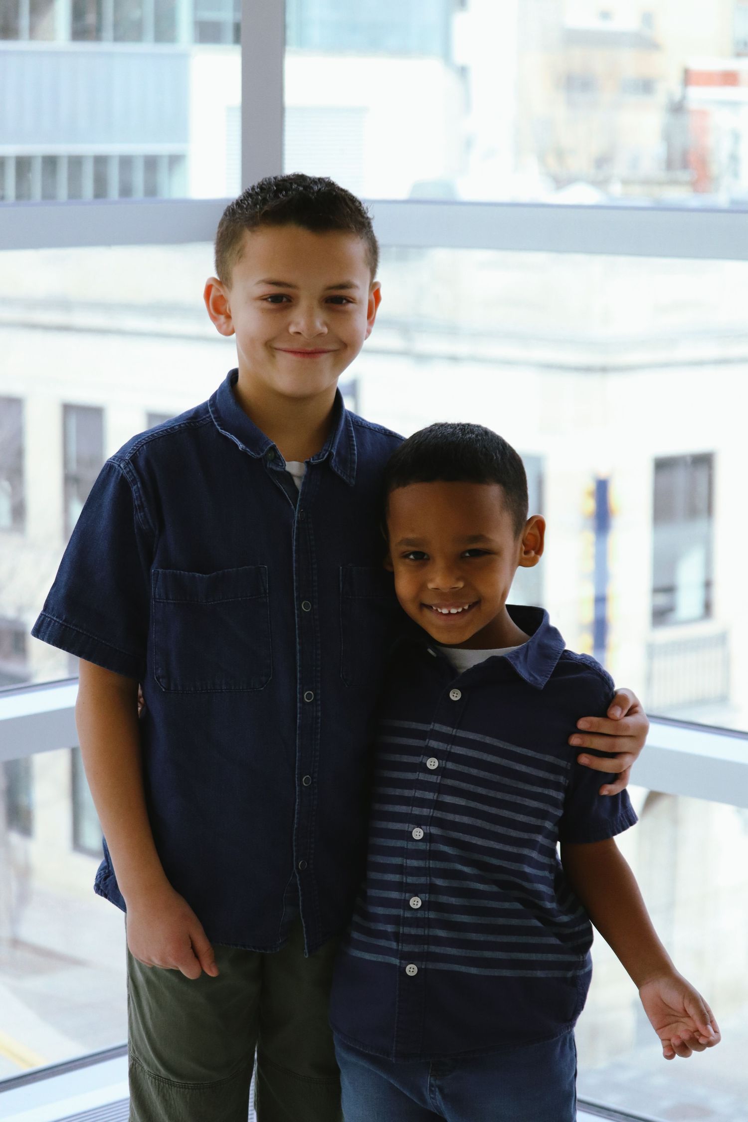 two brothers hugging each other