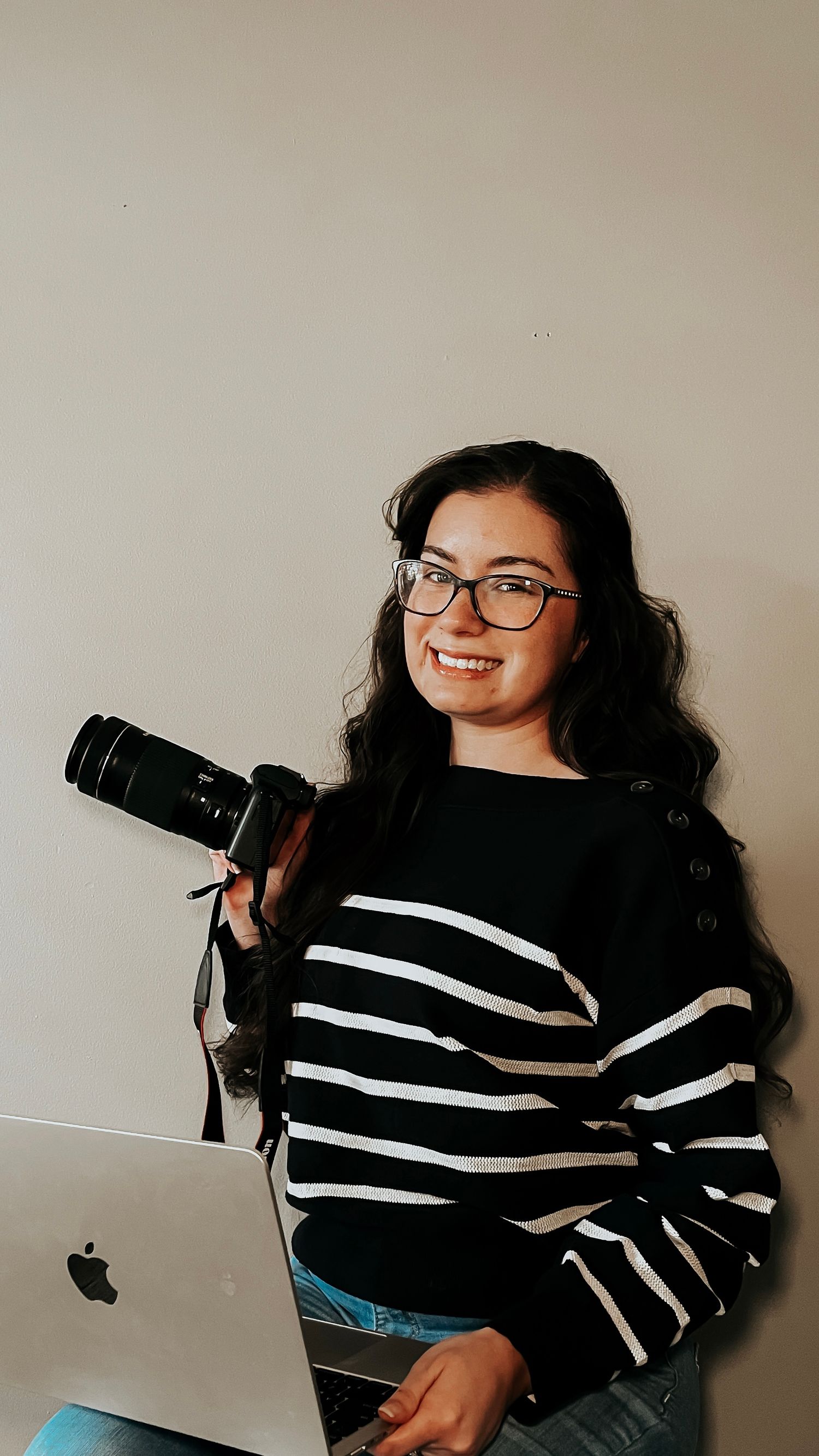 sun prairie photographer, sitting and holding a camera