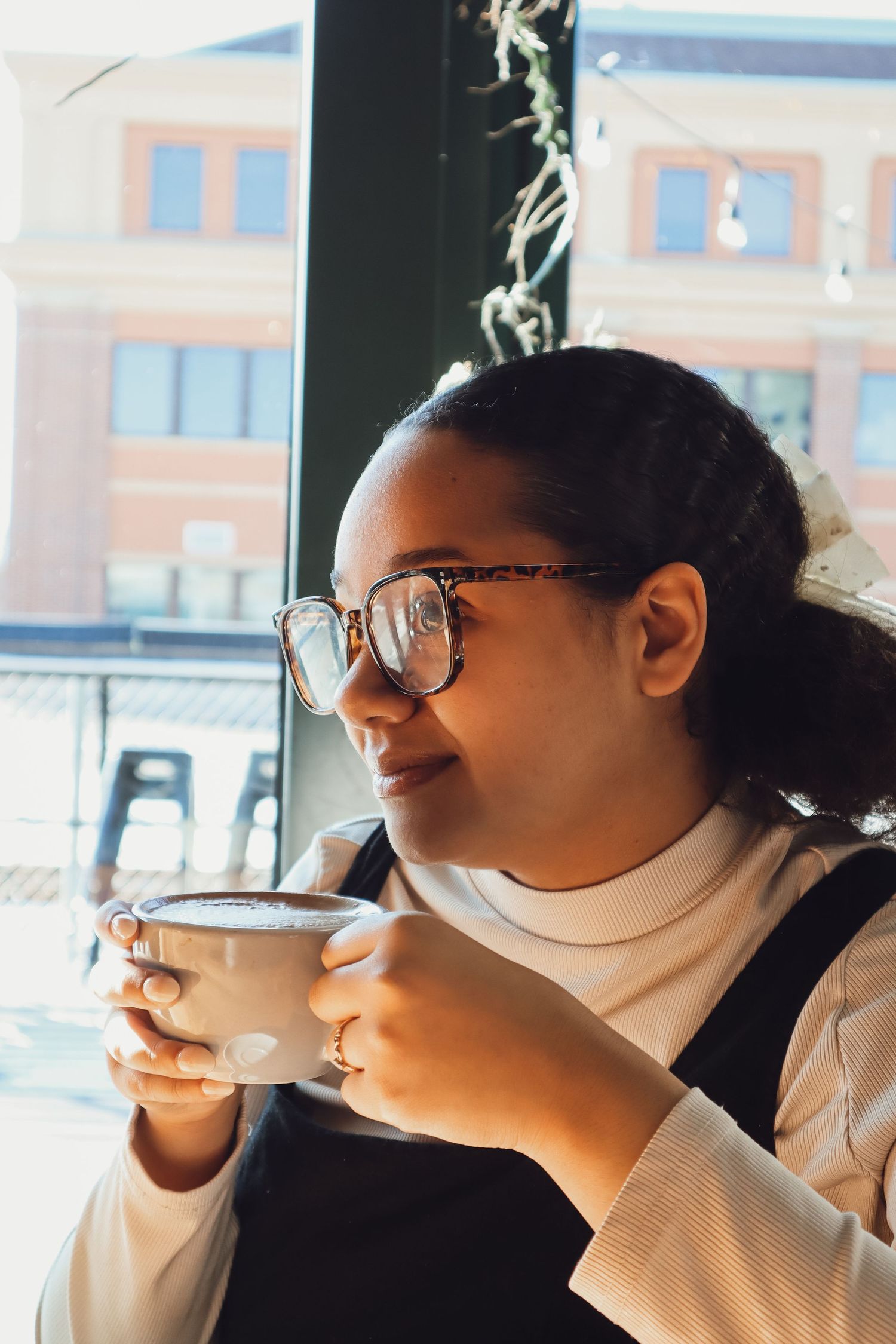 female sitting in a coffee shop