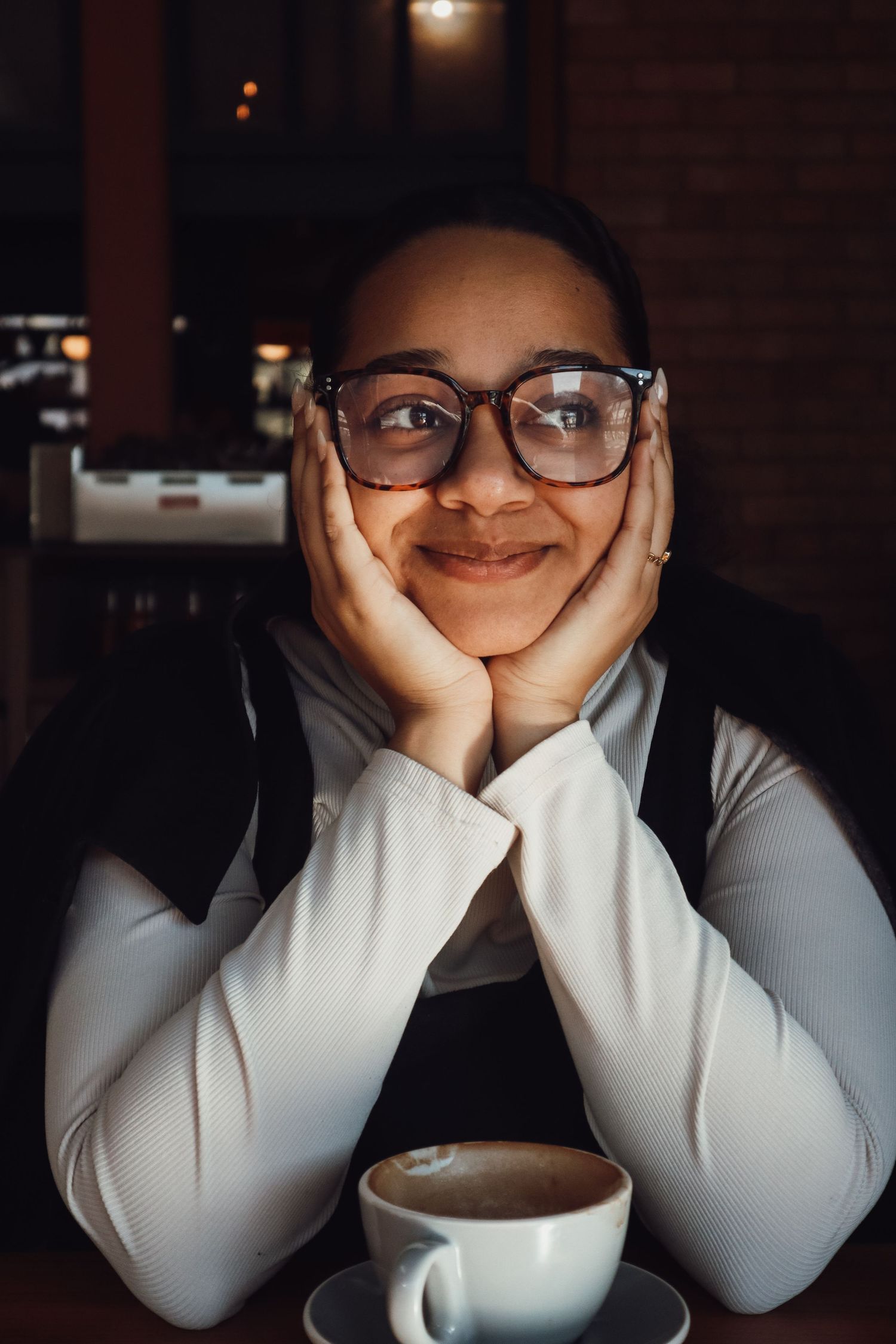 female sitting in a coffee shop