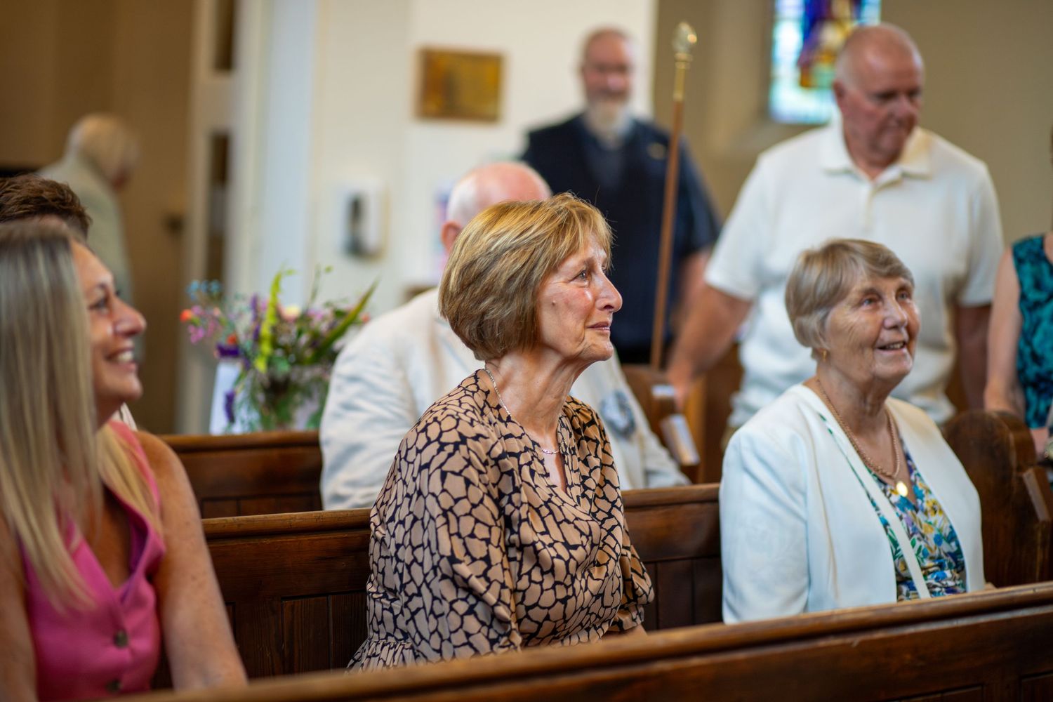 Grandmother welling up and crying at families Christening