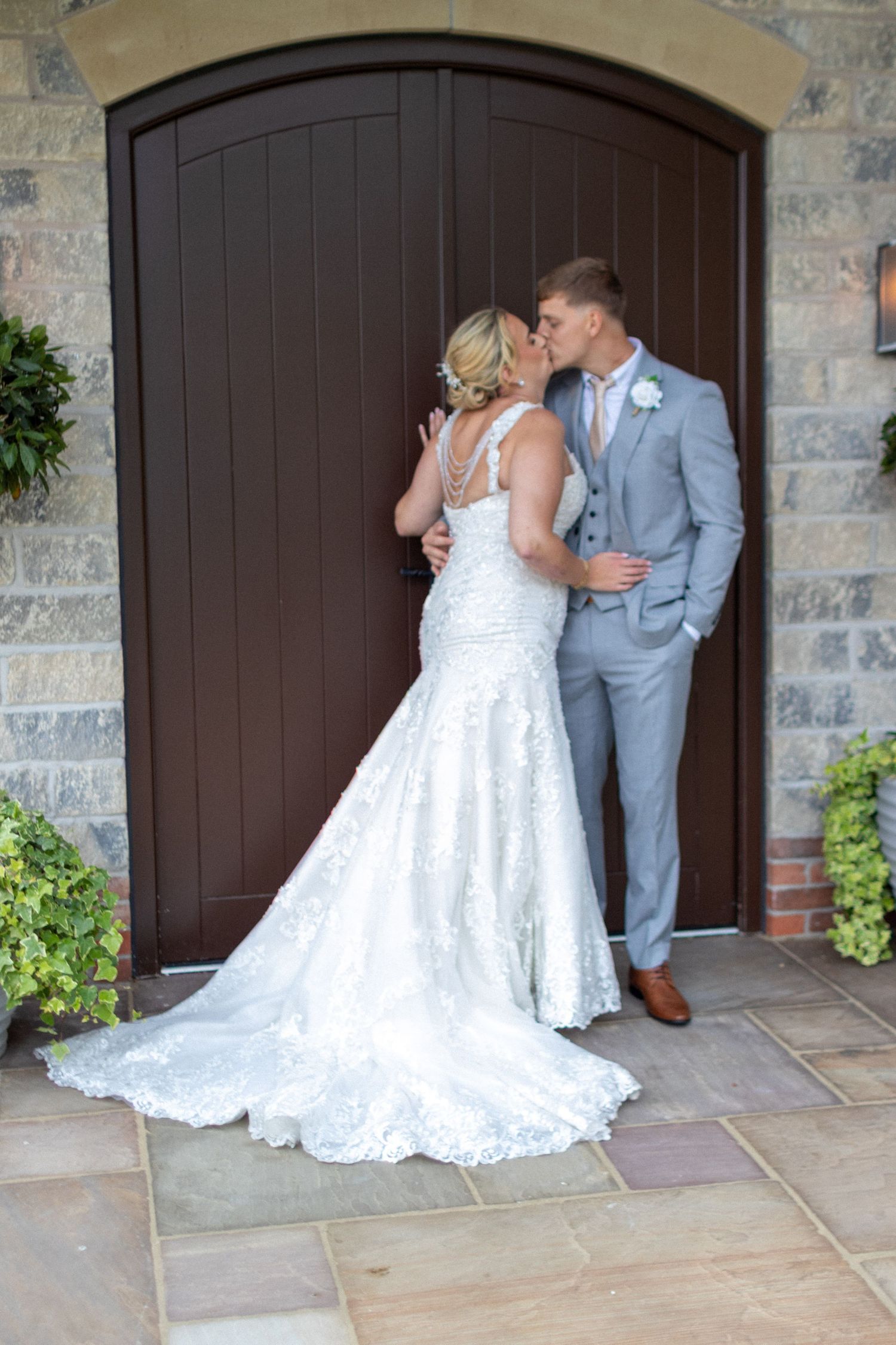 Bridge and Groom kissing each other after their Wedding