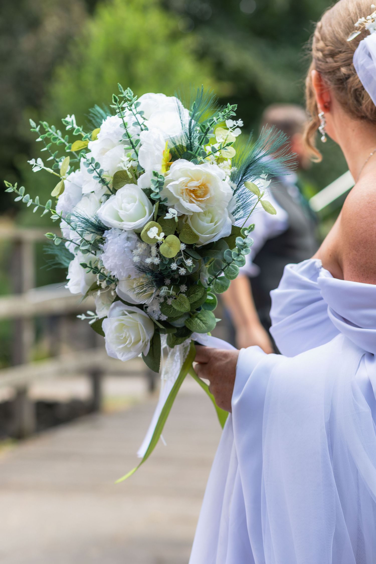 Bride holding her wedding bouquet at Clifton Park Museum